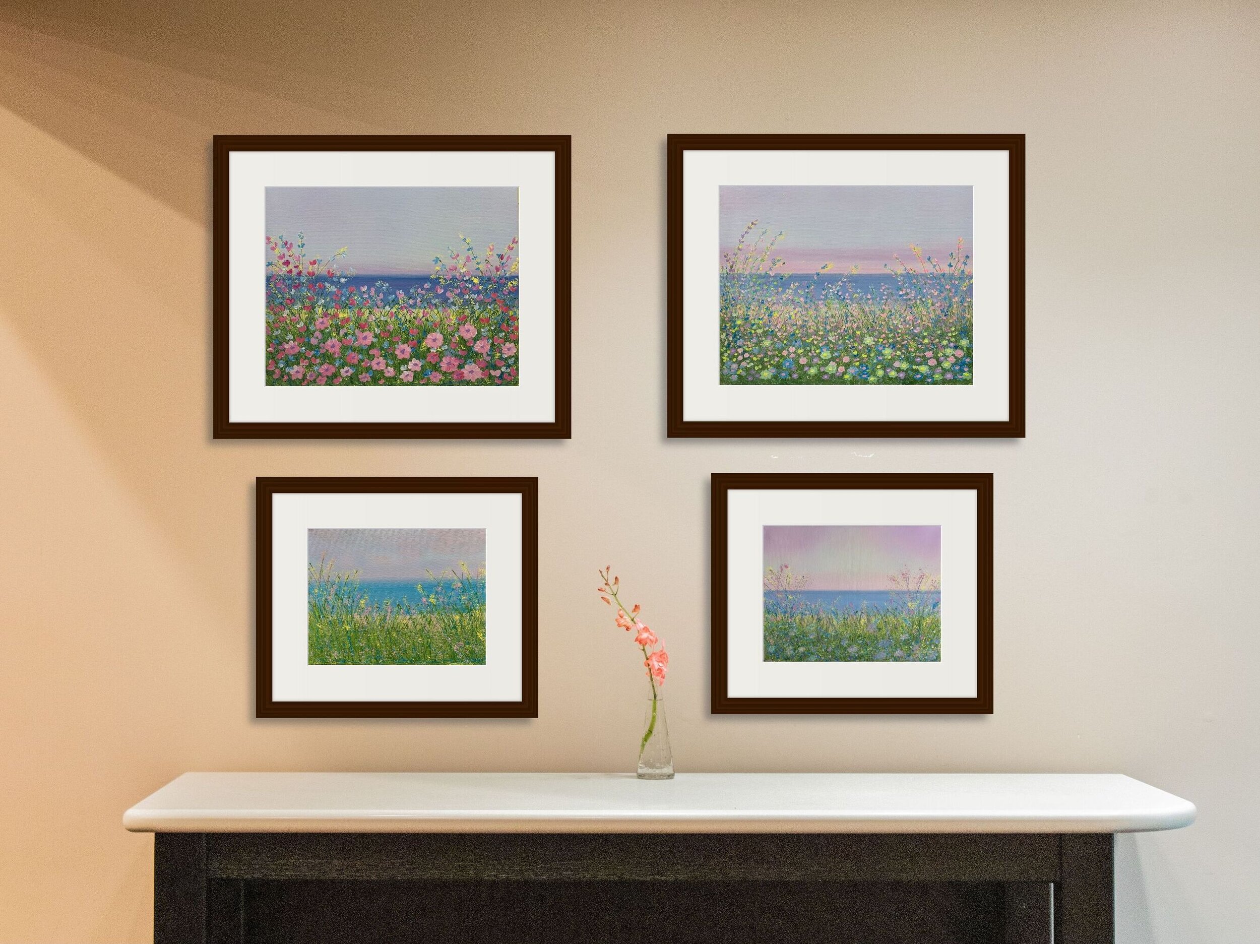 four lakeside floral paintings on wall over table