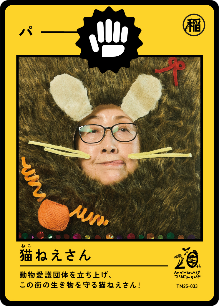 A person with glasses lying down with head surrounded by a furry material, wearing felt bunny ears and nose, and surrounded by craft yarn and pipe cleaners