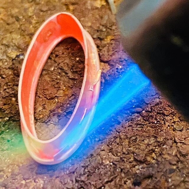 Soldering outside band onto a bezel for gorgeous turquoise earrings. I am still in awe of the amazing spectrum of colours when heating precious metals and that glistening molten streak of solder in the joint when it flows well 🔥
.
.
@lightwave_jewel