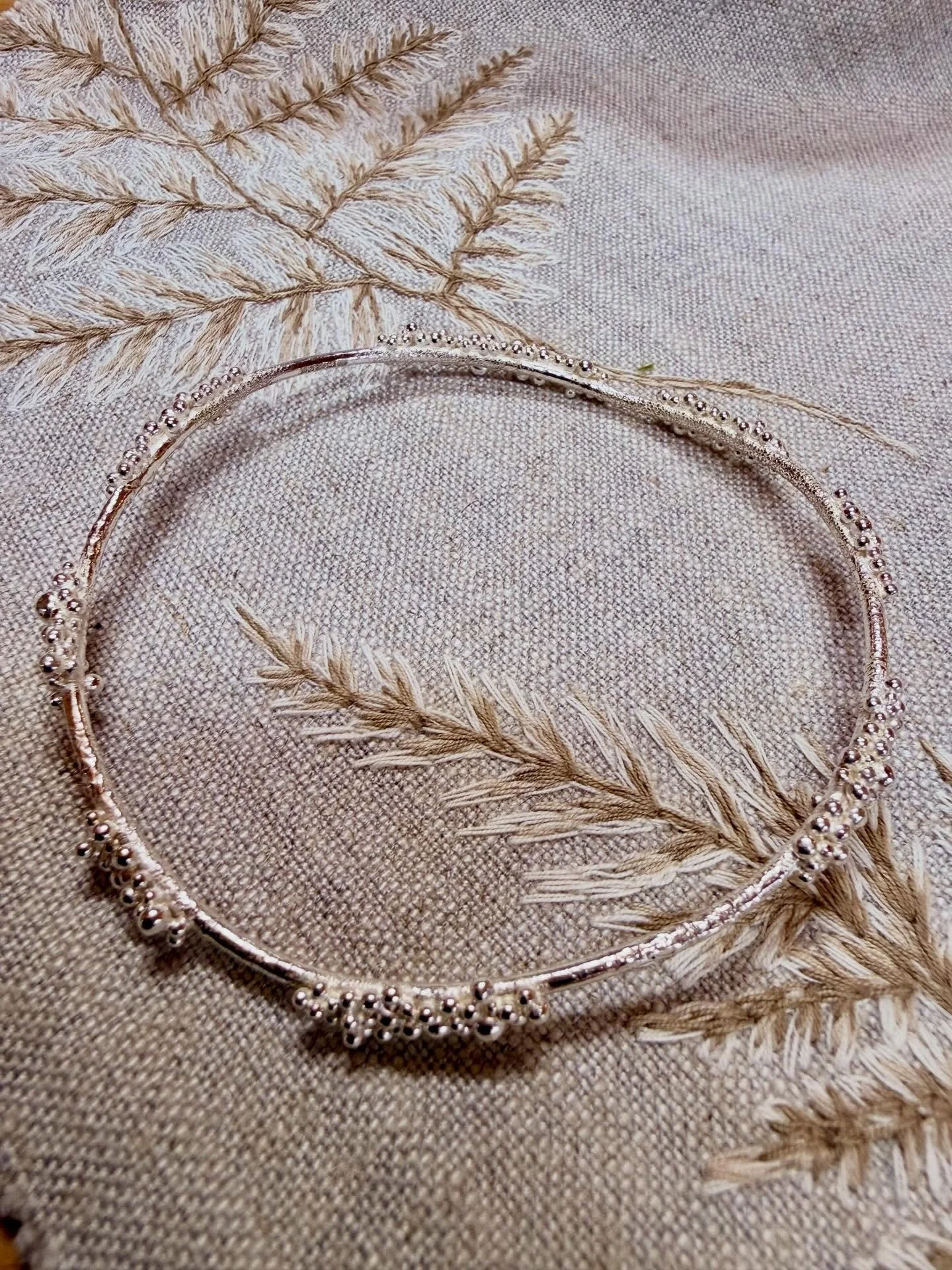 Dew bracelet just back from hallmarking &amp; in stock in my online store. Fine silver granules &amp; reticulated band give it extra shimmer. One of my favourite pieces ✨
.
#sterlingsilverbracelet #newforestjeweller #newforestjewellerycourses