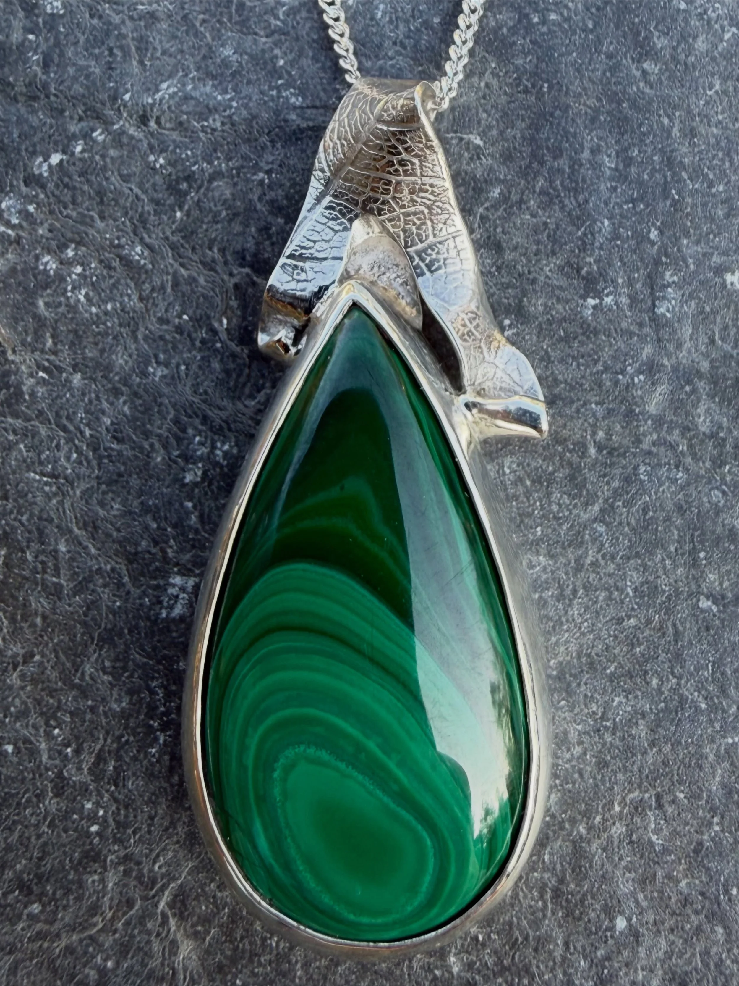 First of four new pendants ✨ Fabulous Malachite with Fiddlehead Fern piercing, freeform embossed leaf bail &amp; a double dinky heart charm, all in sterling silver. I loved piercing out the ferns, and still have the intact cut outs which I will use i