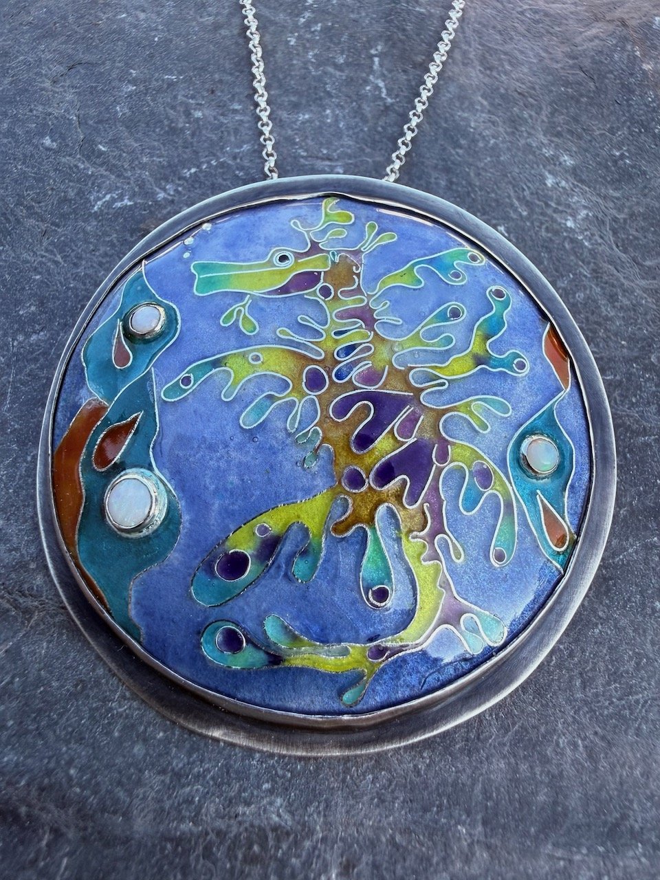 wild thing leafy sea dragon fire enamel silver medallion pendant brooch with 3 opals by Natalia Shoutova handmade jewellery at lightwave jewellery studio in the new forest jewellery courses