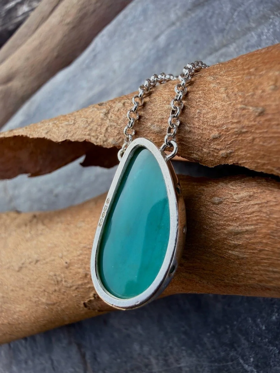 Teal turquoise blue opalised wood silver pendant natalia shoutova lightwave jewellery new forest jewellery courses