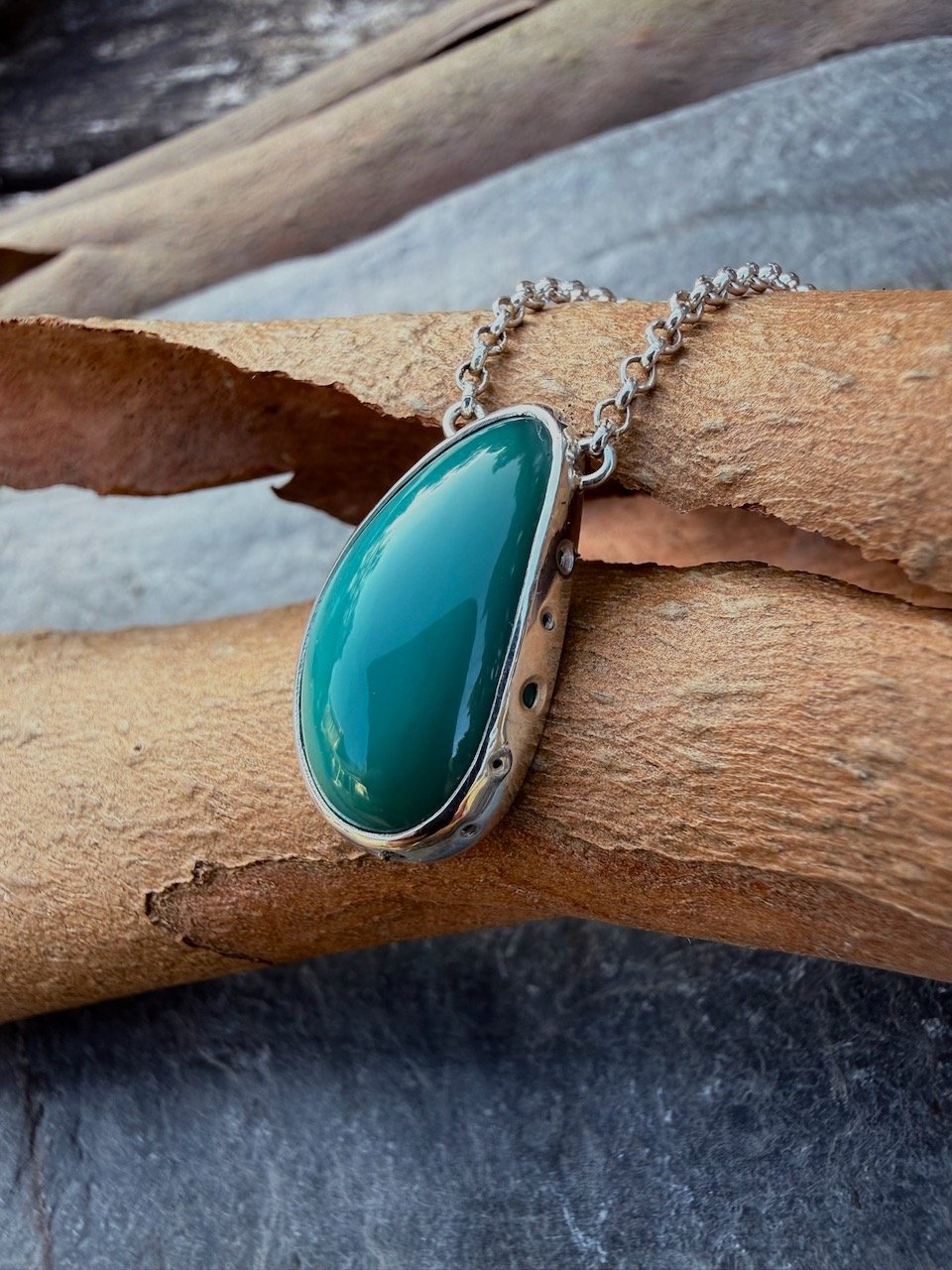 Teal turquoise blue opalised wood silver pendant natalia shoutova lightwave jewellery new forest jewellery courses