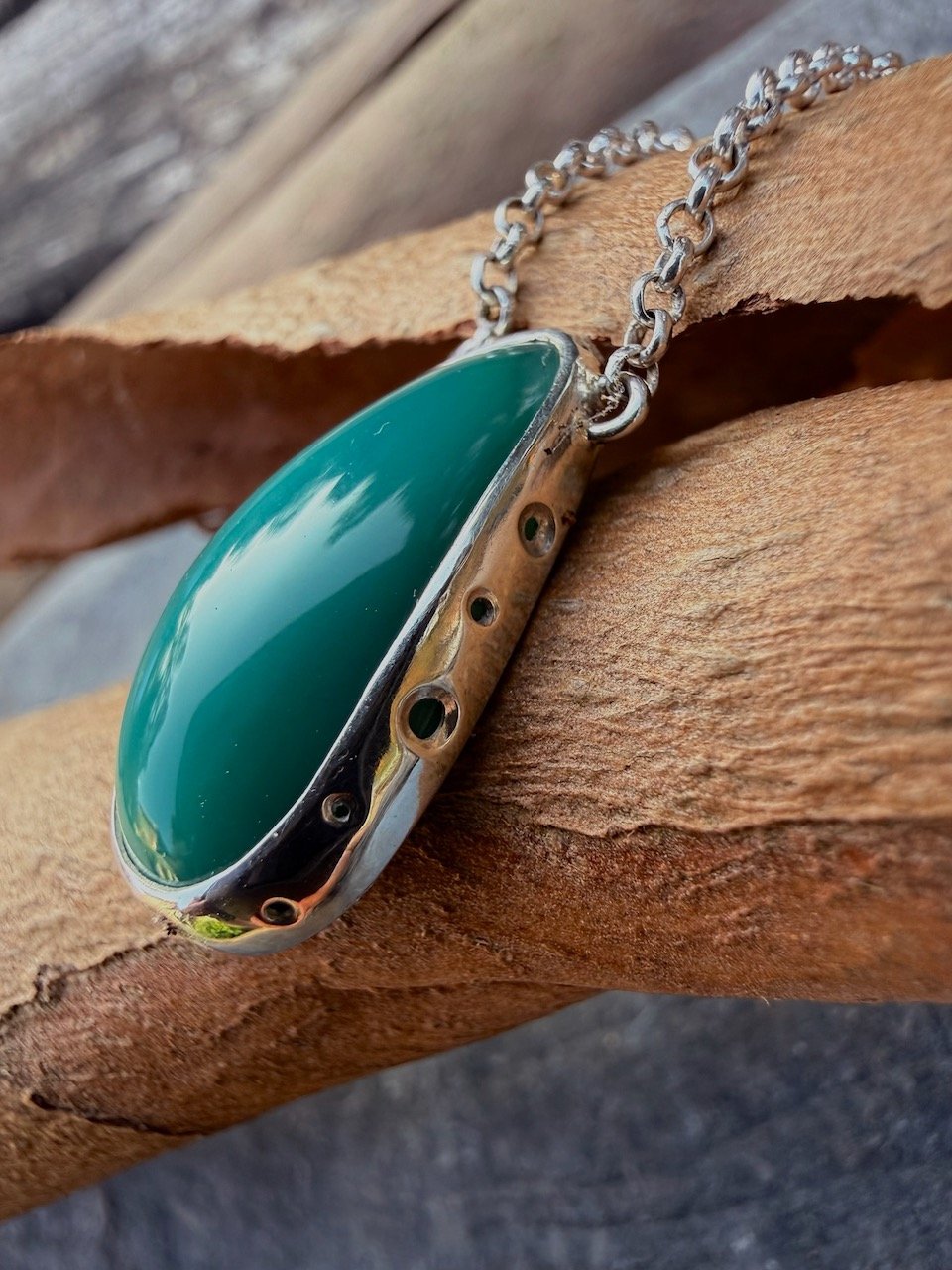 Teal turquoise blue opalised wood silver pendant natalia shoutova lightwave jewellery new forest jewellery courses