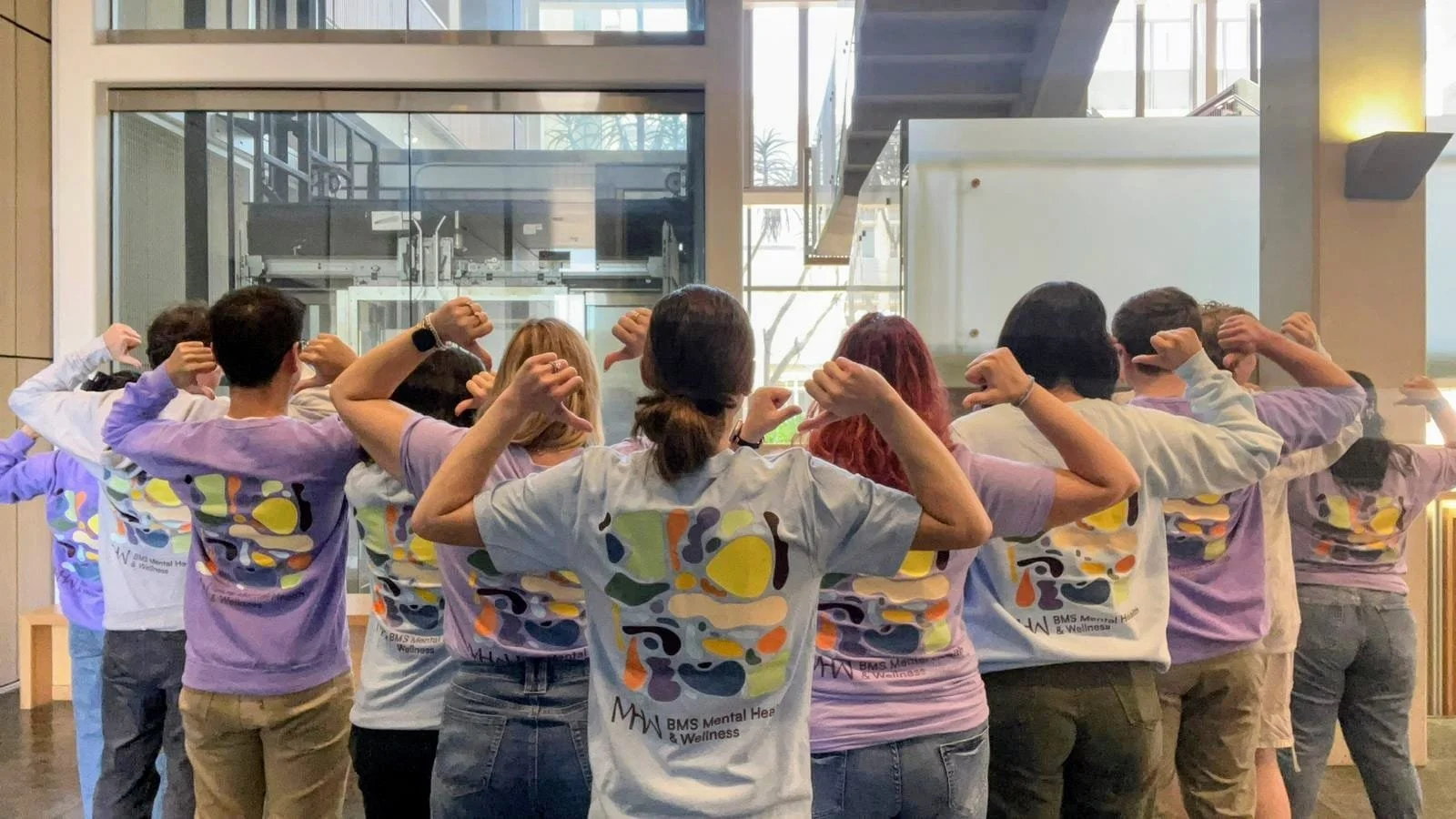 volunteers showing off their BMS MHW shirts