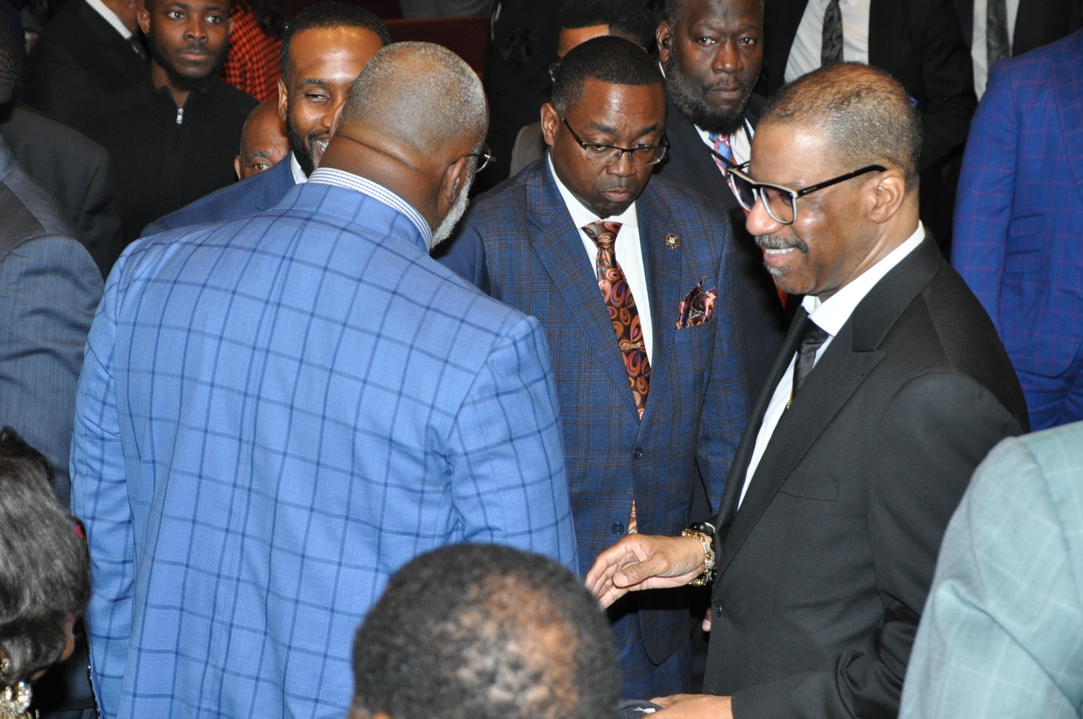 Bishop Sheard (COGIC) greets crowd at ecumenical service.jpeg