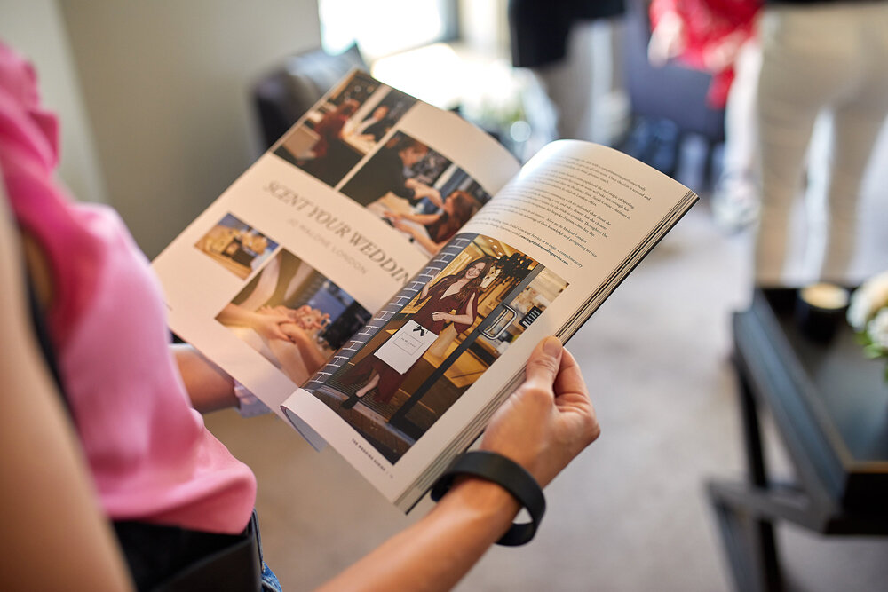 A guests reads about the Jo Malone ‘Scent Your Wedding Experience’ offered as part of our Bridal Concierge Service.