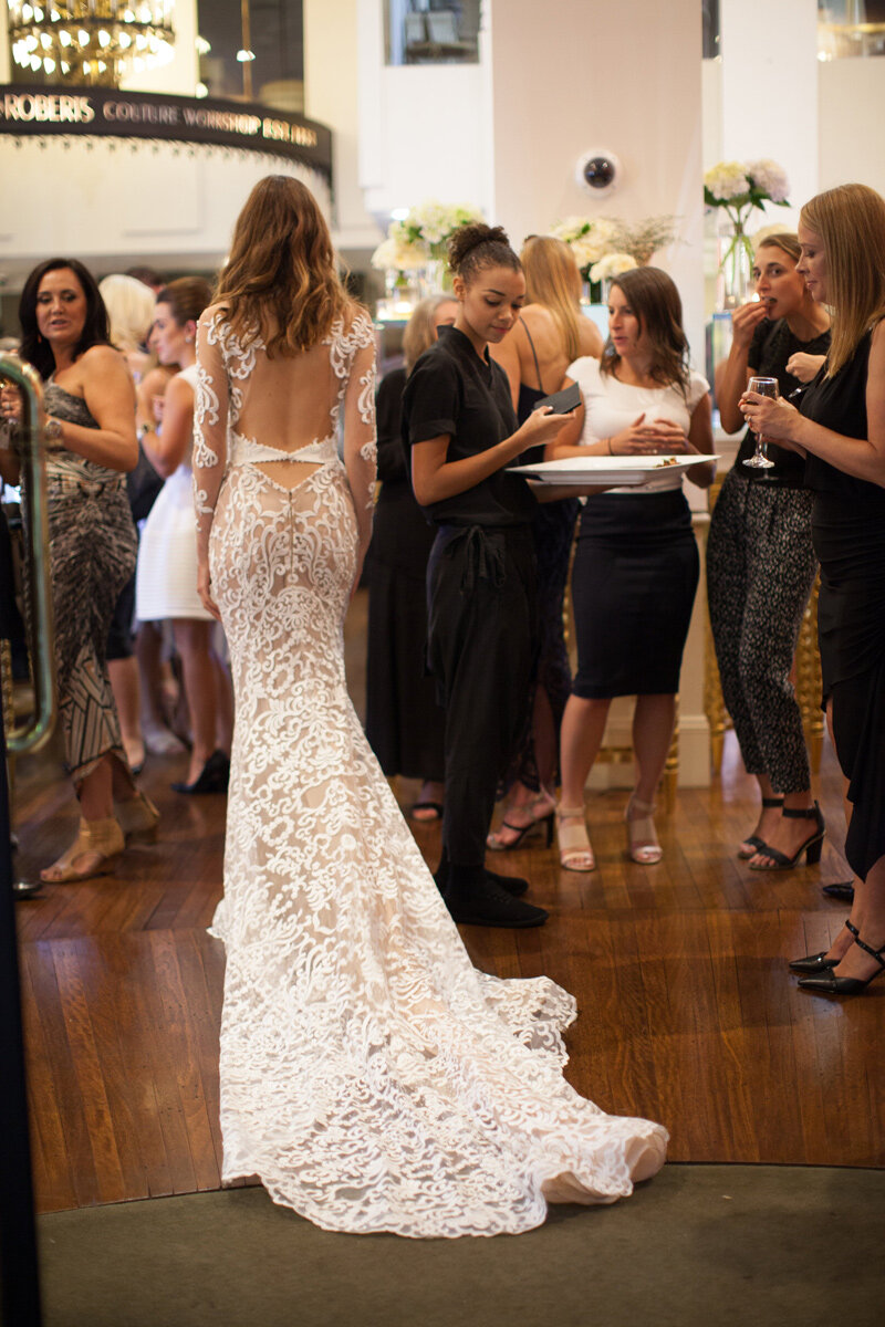 Model walks across the magnificent Fairfax &amp; Roberts boutique in a breathtaking Steven Khalil Couture Gown