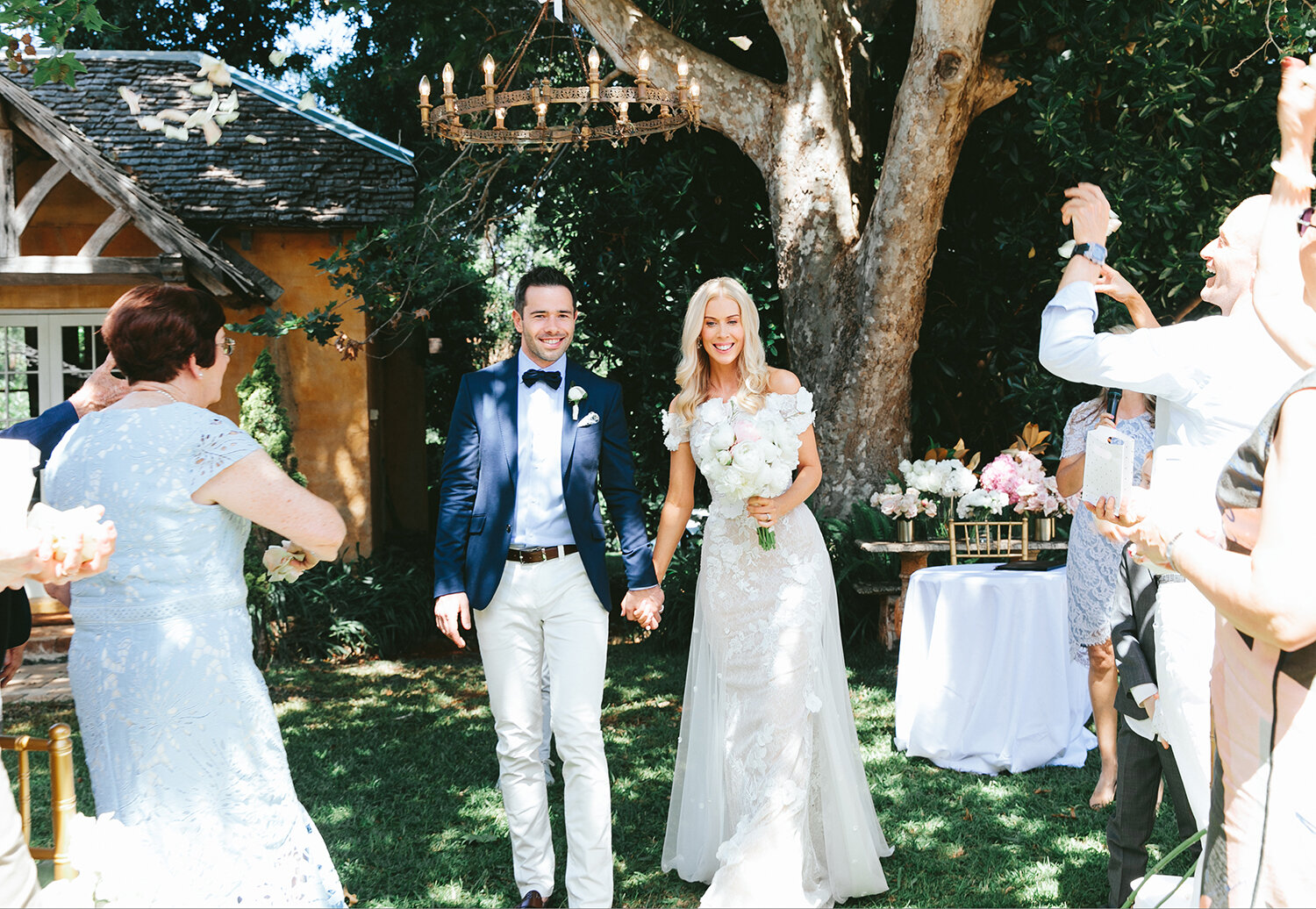 Just married. Bride, Kerrie Hess and Groom, Peter Collins, walking down the aisle.