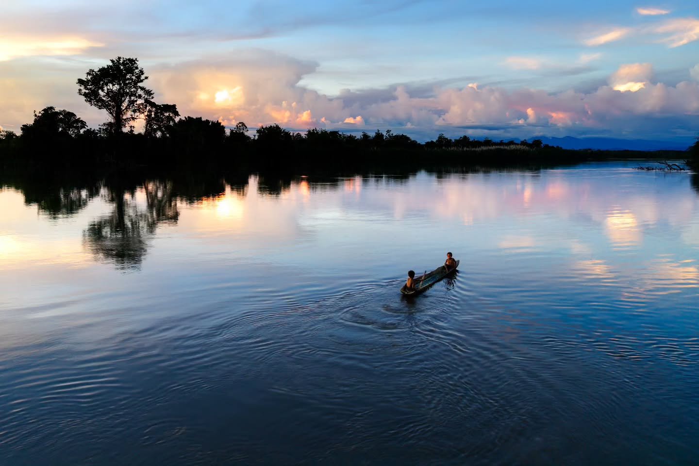 Small boys paddle quietly past our houseboat in their dugout canoe. 
Karawari River,  Papua New Guinea.

Limited space available for 2027.

#chrismclennanphotoexpeditions #papuanewguinea #phototour 
@nikonnz @nikonaustralia #culture