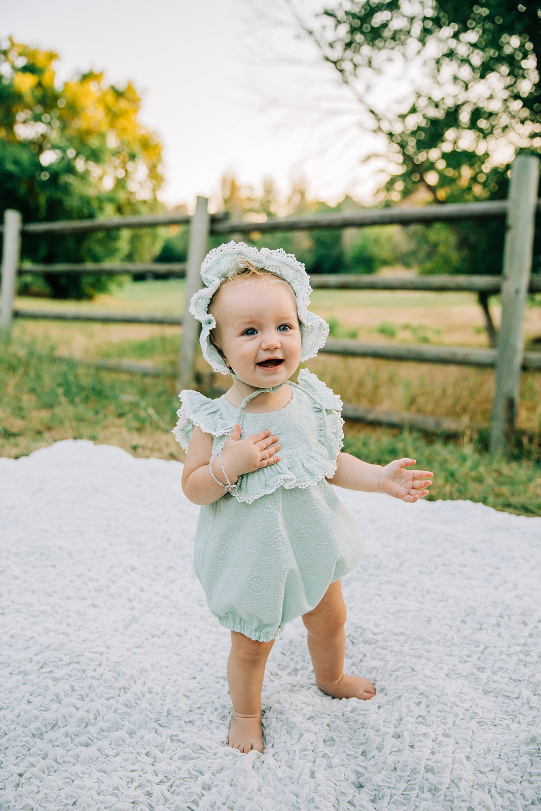  baby posing inspo standing baby poses outfit change cute bonnet mint baby out fit happy baby smiling girl adorable baby outfit birthday photoshoot girls day baby clothing inspo kids fashion inspo baby bracelet elegant baby style posing ideas for kid