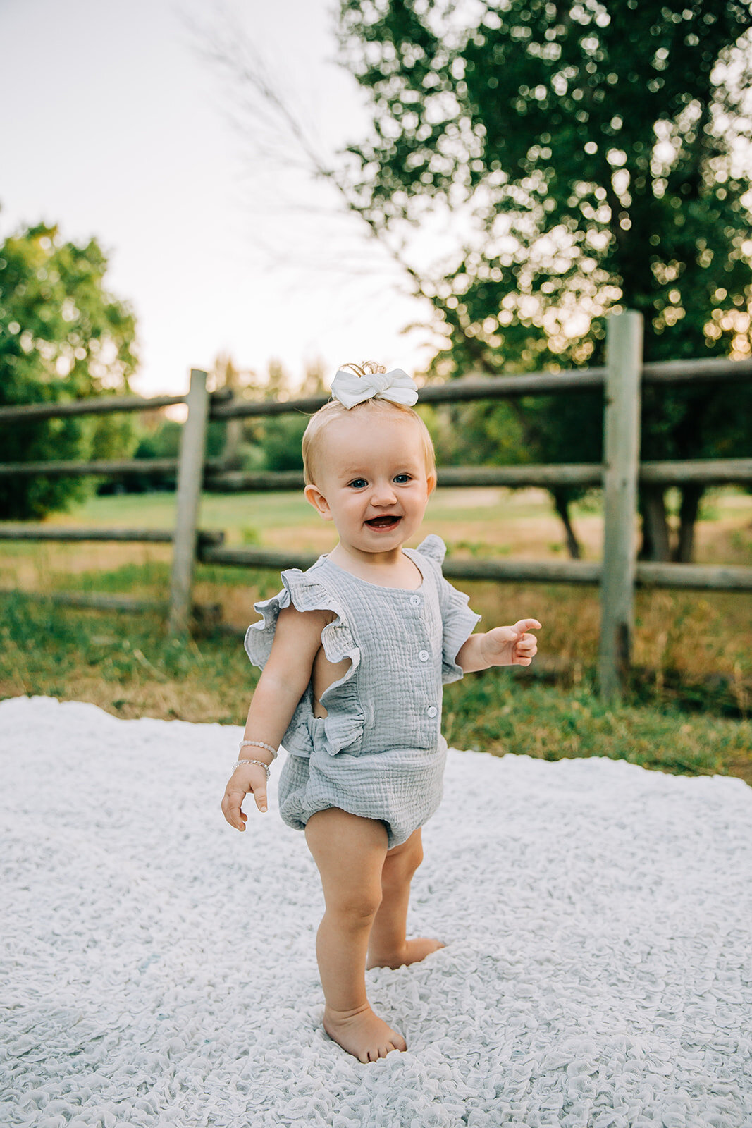  kids photography green field simple background sunny day outfit change kids fashion inspo baby girl outfit insp standing on a blanket baby posing standing poses inspo baby jewelry inspo first birthday turning one year old girl power cache valley pho