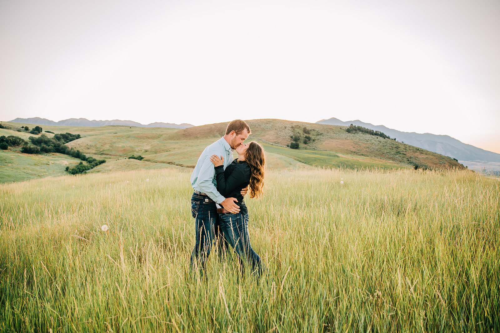  Utah engagement session romantic photo session intimate pictures semi-formal attire engagement session hair inspo curly hair men and women hairstyles kissing pictures couple posing inspo in love paradise Utah family land cache valley photographer hu