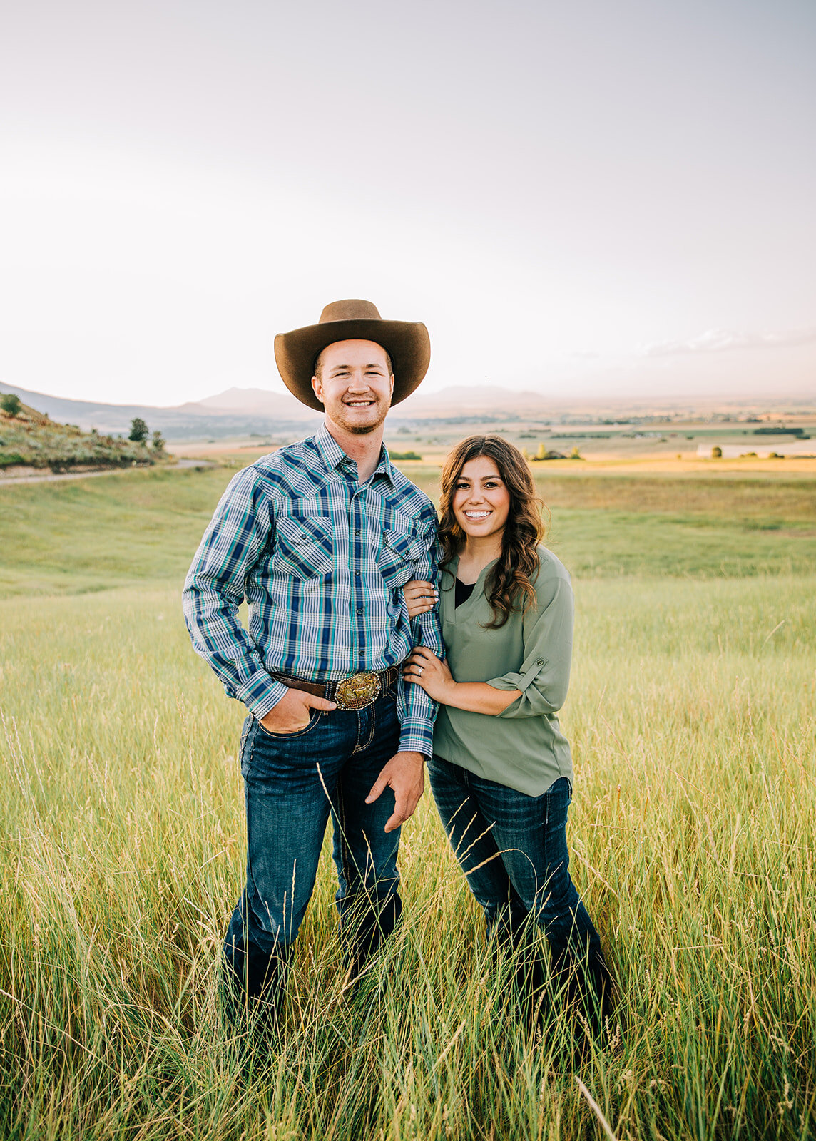  summer time engagement session casual outfit inspo Utah couple swing dancing partners country lovers future husband and wife green field standing posing ideas simple posing hand in pocket engagement posing ideas bride to be professional photographer