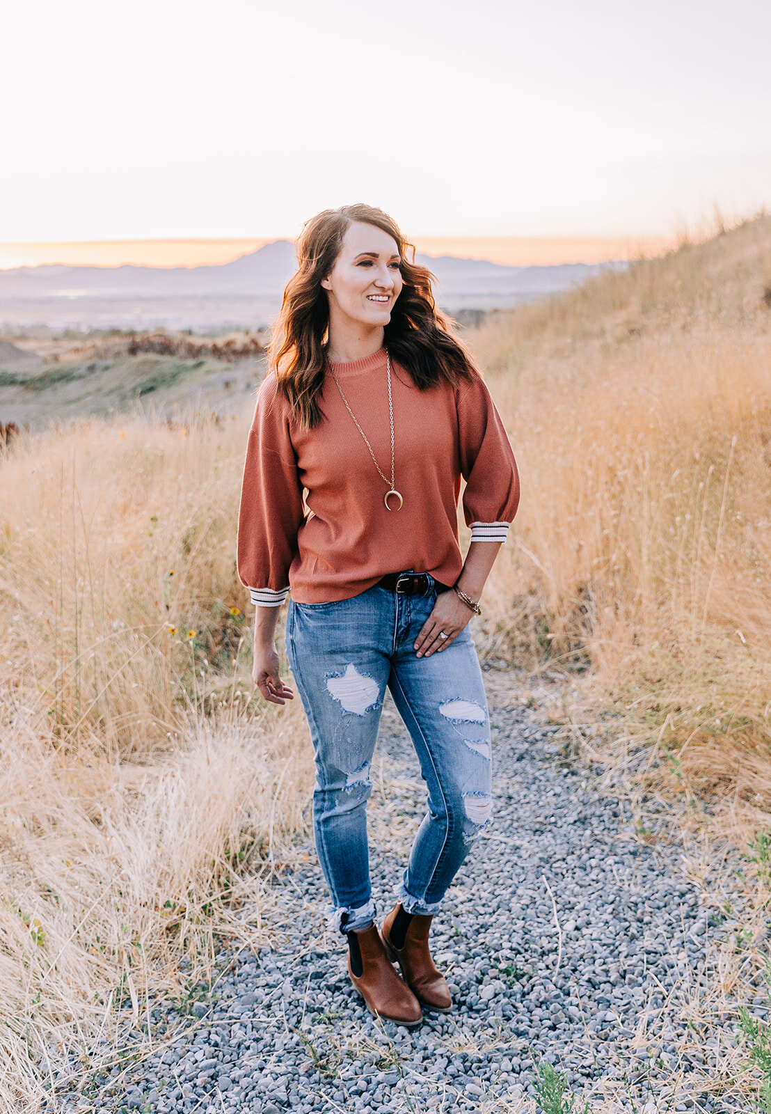  women’s clothing boutique tremonton utah storefront fashion photography bella alder professional commerical photos for online clothing boutique the classic shop rust red top with distressed jeans classy casual outfit go-to fashion style brunette mod