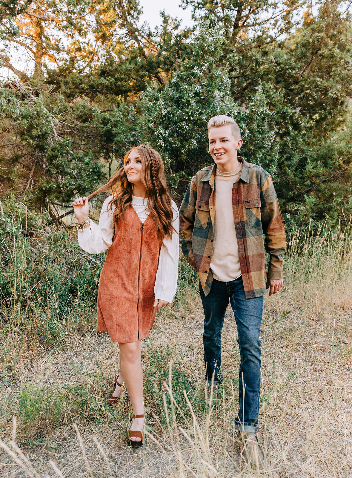  playing with her hair pretty models outfit inspiration for fall family pictures color scheme browns and greens and golds posing for fashion portraits of new inventory for the classic shop online clothing boutique tremonton utah northern utah commerc