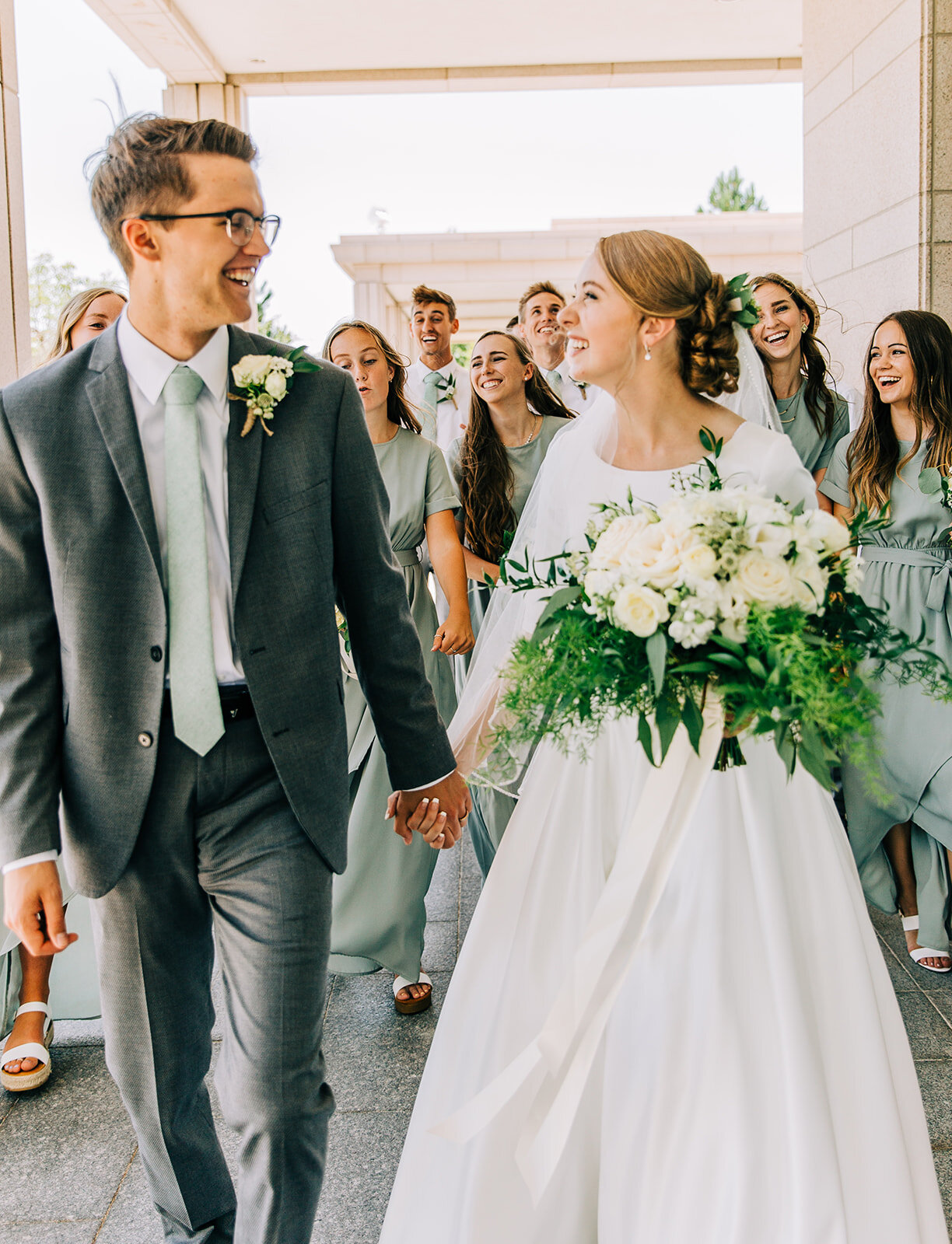  bride and groom looking into each other’s eyes holding hands after their sealing ceremony husband and wife oquirrh mountain temple lds wedding ceremony south jordan utah wedding photographer bella alder photography affordable wedding pictures on a b