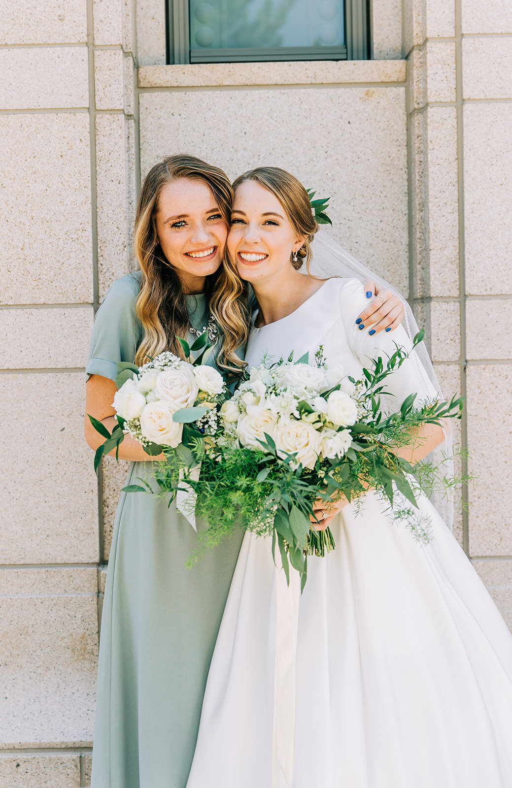  bride posing with her bridesmaid friends and family at the wedding sea green bridesmaid dress inspiration floral bouquet bridal attire ensemble inspiration for summer wedding inspo lds bride temple wedding pictures after the sealing hair and make-up