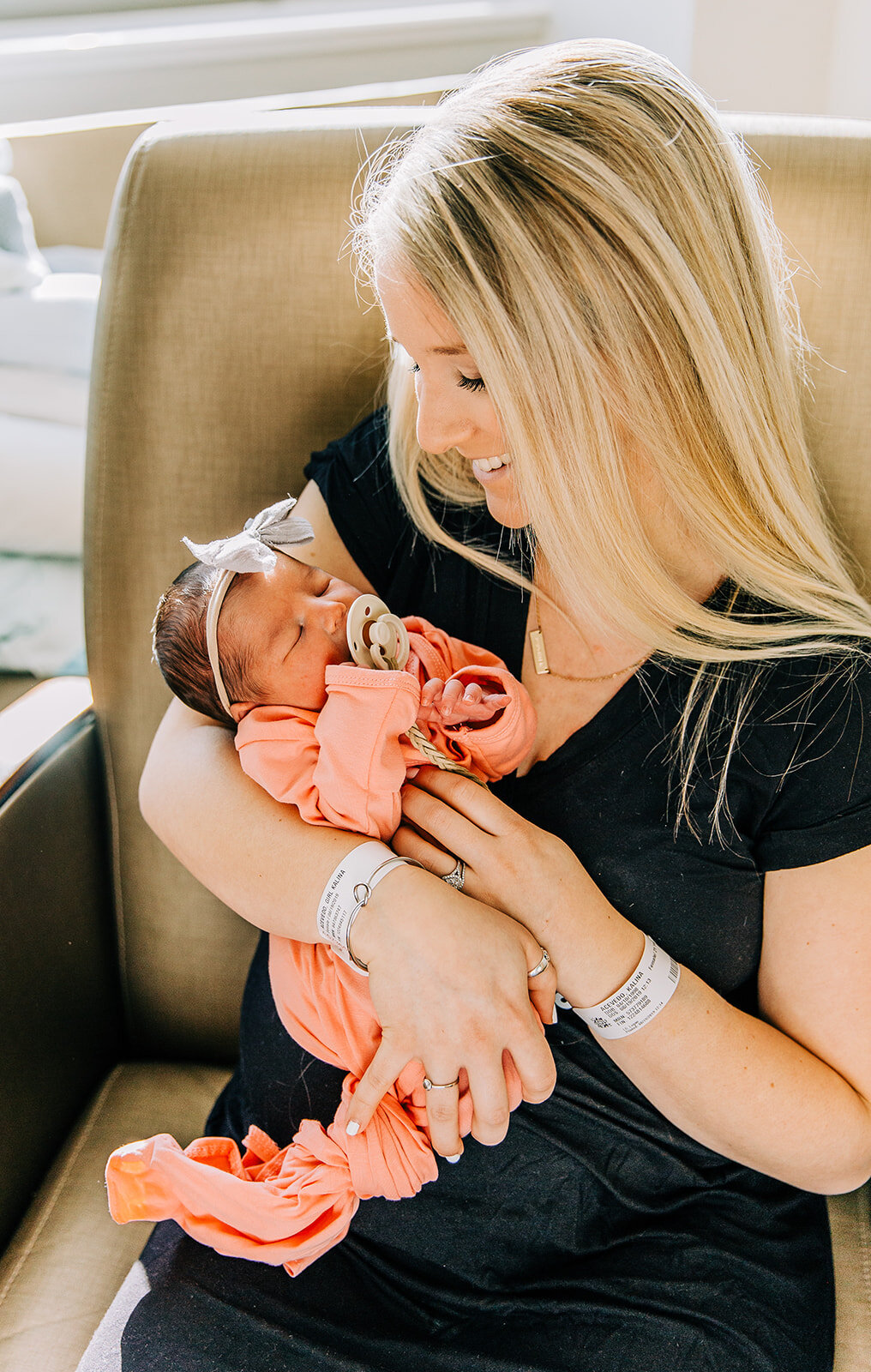  birth story newborn photos in logan regional hospital professional baby photographer family photos fresh 48 affordable newborn session logan utah pink dress baby girl with her mom mommy and me new mom first time mom holding her baby girl grey boy he