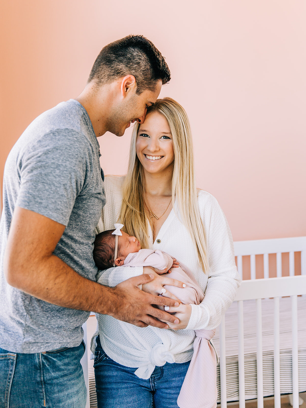  newborn baby girl pictures in blush door studio pink wall natural light photography studio affordable logan utah photography newborn baby pictures with new parents first time parents young mom and dad newborn session #babygirl #itsagirl #newborn #ne