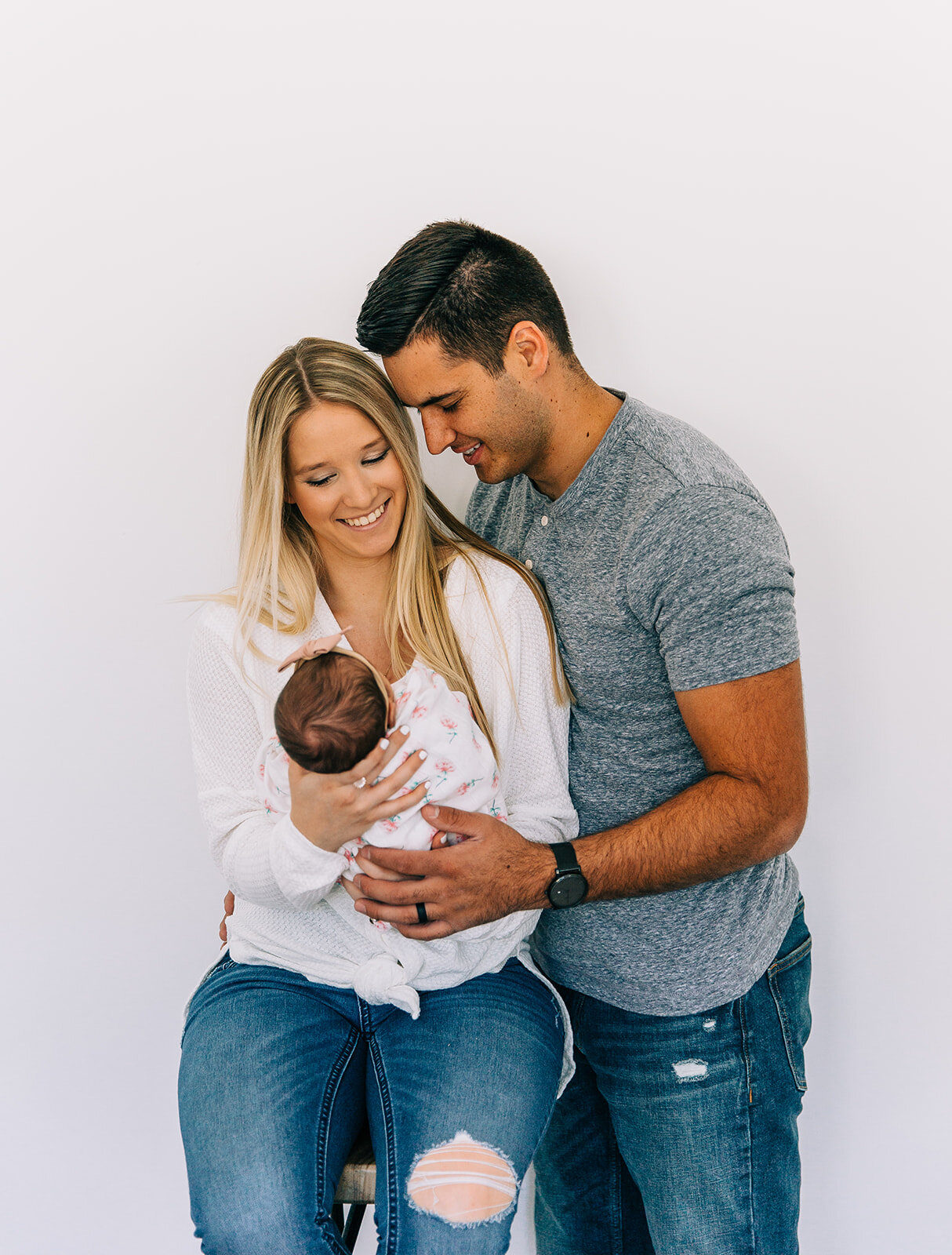  mom and dad holding newborn baby girl pose ideas professional baby photos newborn session in blush door studio in logan utah bella alder photography available for travel in northern utah and the surrounding areas for newborn photography affordable p