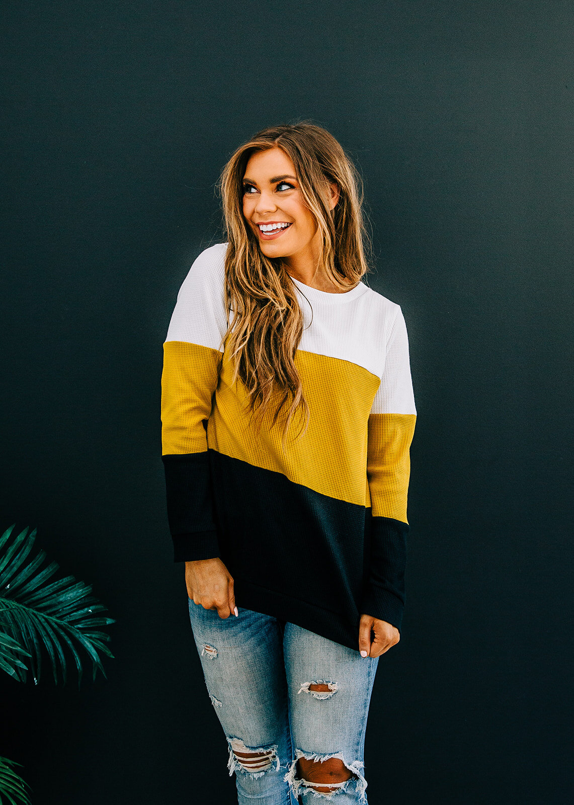  color block sweater with big stripes mustard white and black blocks of color waffle knit long sleeve sweater fashion top smiling looking away beachy waves pretty model logan utah clothing boutique online inventory new product photography fall outfit