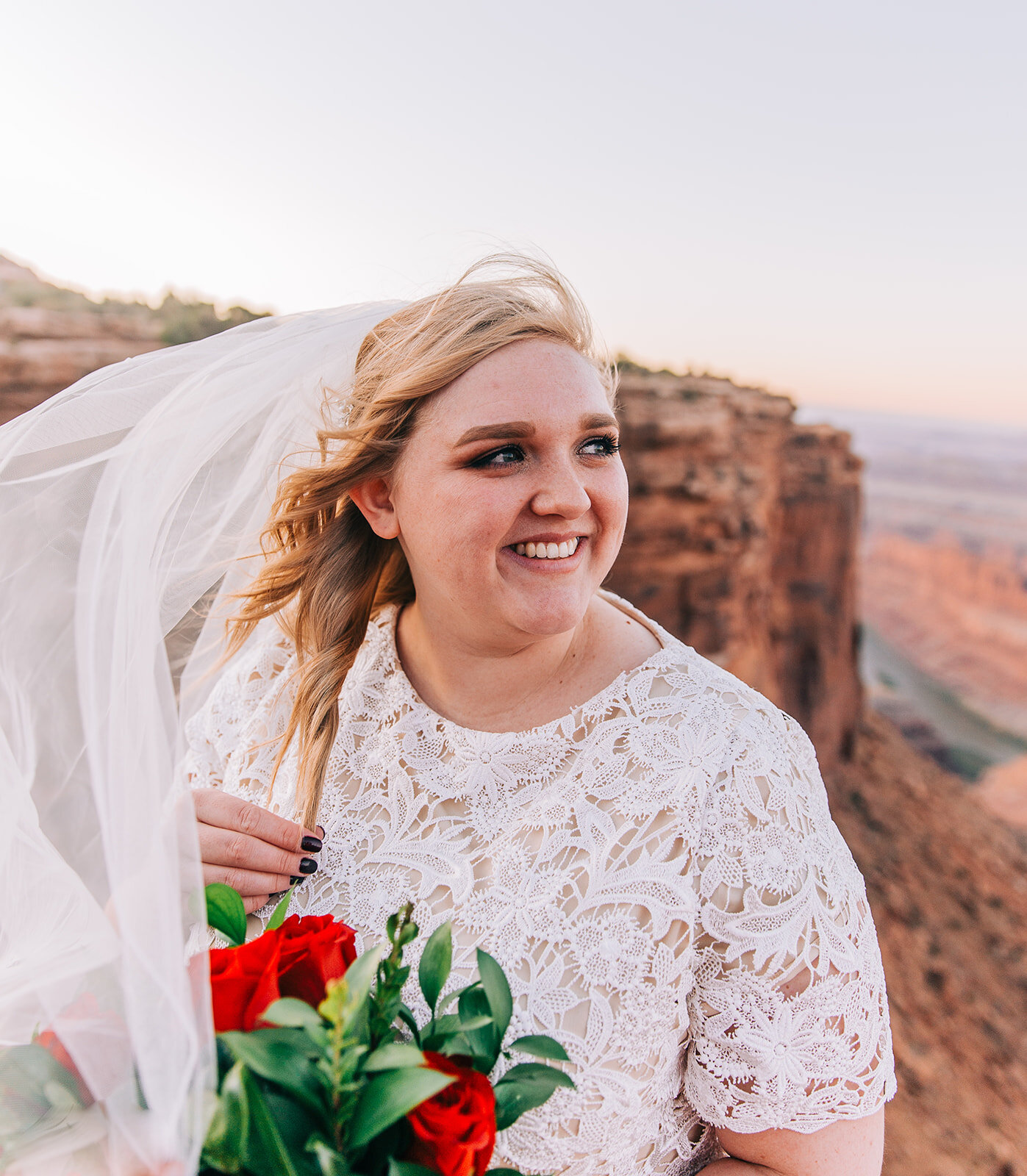  moab utah bridal hair and makeup inspiration bride hair veil styling bridal fashion modest wedding dress white dress veil bouquet inspiration wedding florals double arch elephant rock professional photographers in utah utah wedding photographers bri