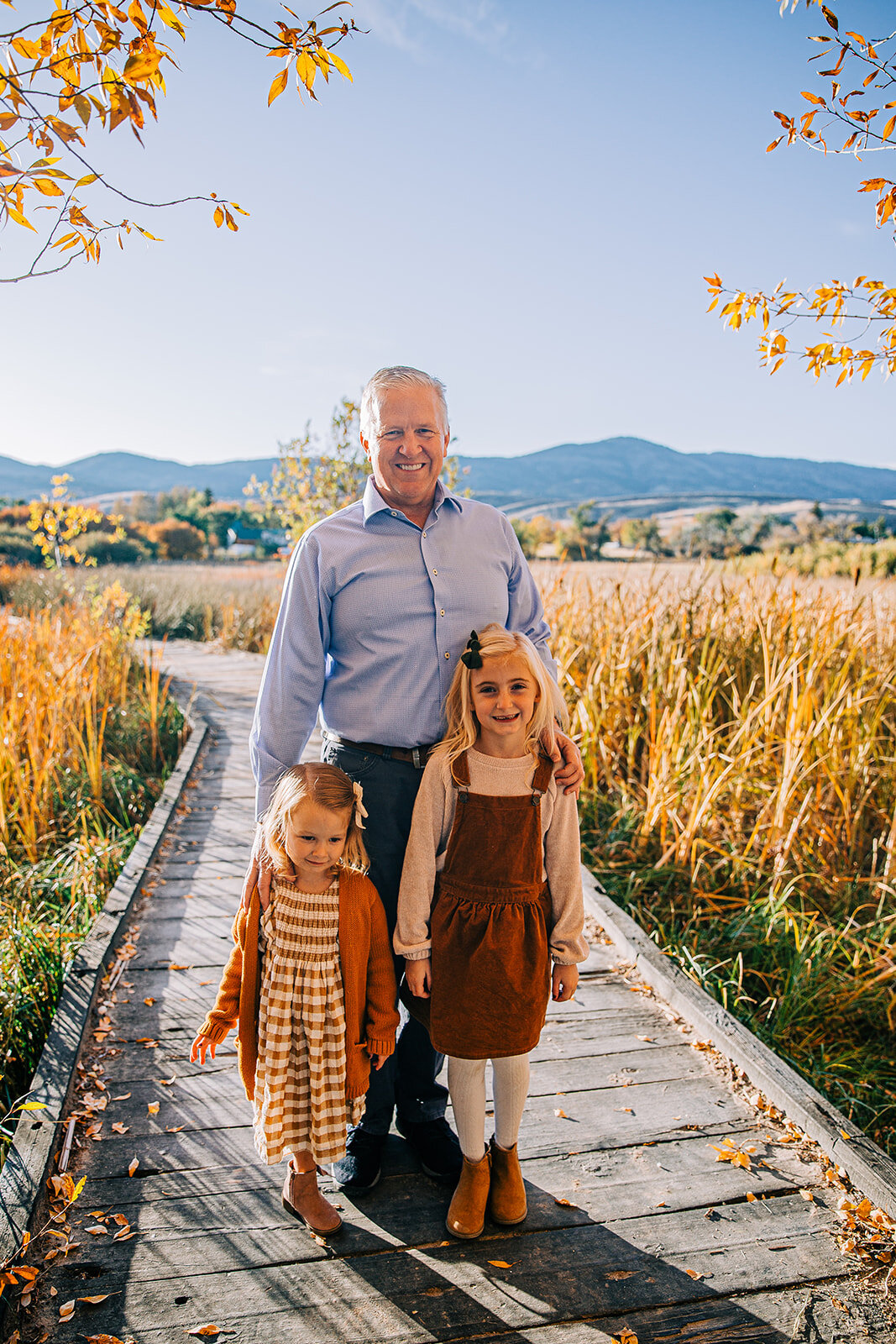  grandpa with granddaughters boardwalk family pictures garden city park bear lake utah together again fields of gold mountains lakeside photos professional photographers in utah utah family photographers extended family siblings families are forever 