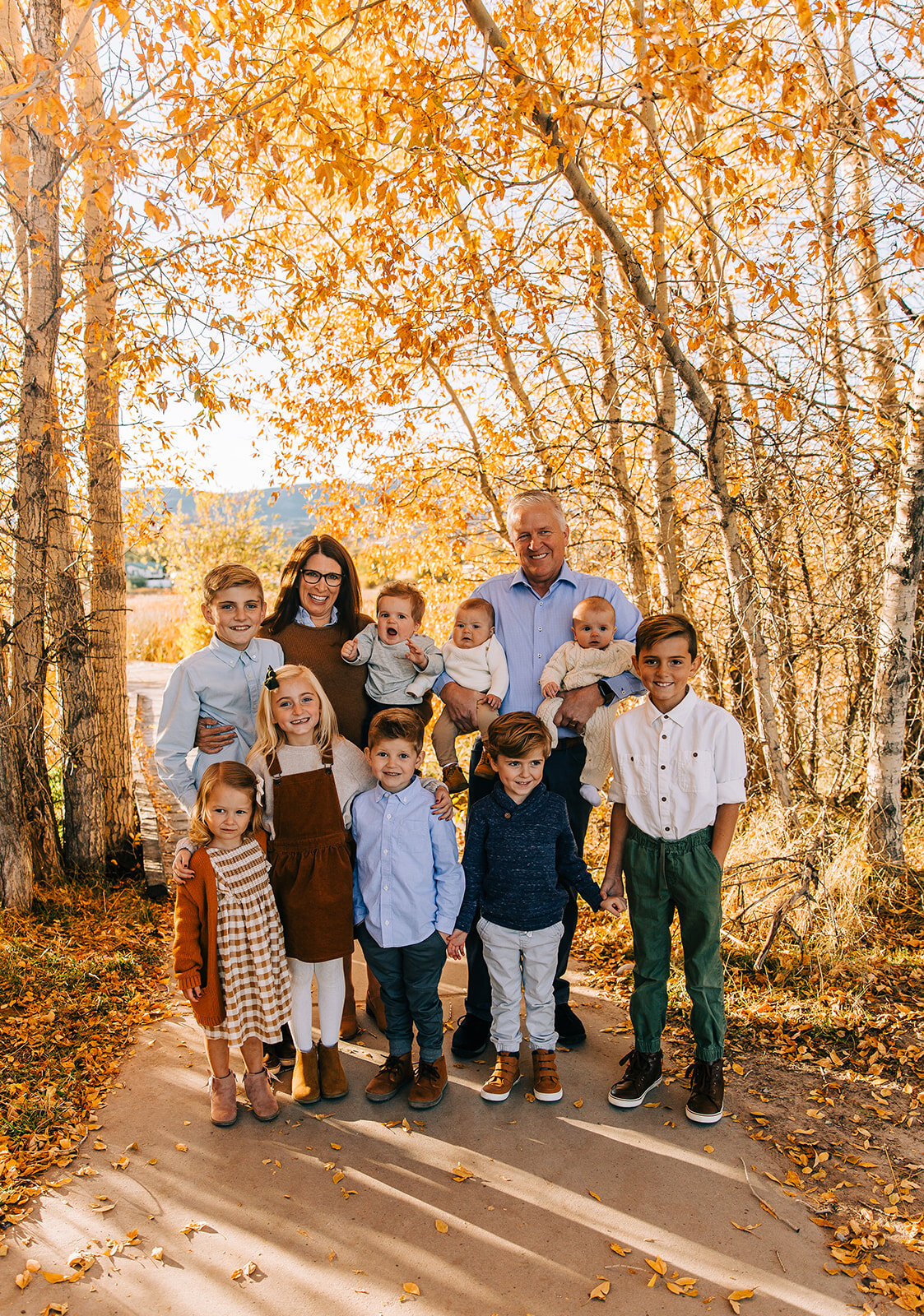  grandma and grandpa with grandkids granddaughters grandsons boardwalk family pictures garden city park bear lake utah together again fields of gold mountains lakeside photos professional photographers in utah utah family photographers extended famil