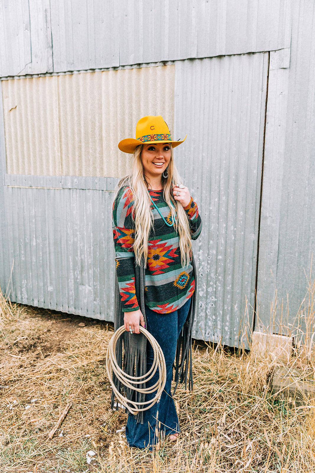  statement jewelry tassle cardigan native print shirt bold yellow cowgirl hat lasso denim long hairstyles hair and makeup inspiration country style professional photographers in utah commercial photographers in utah horses wild rag boutique commercia