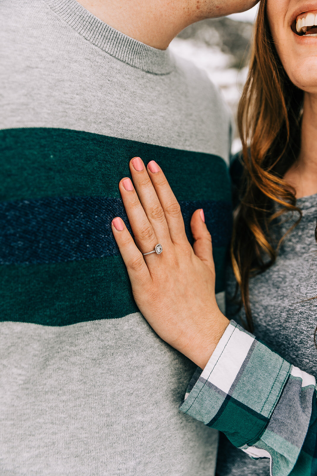  showing off the engagement ring couple pose inspiration happy couple winter engagement session couple pose inspiration bella alder photography professional utah photographer client attire inspiration for men and women logan couple utah couple couple