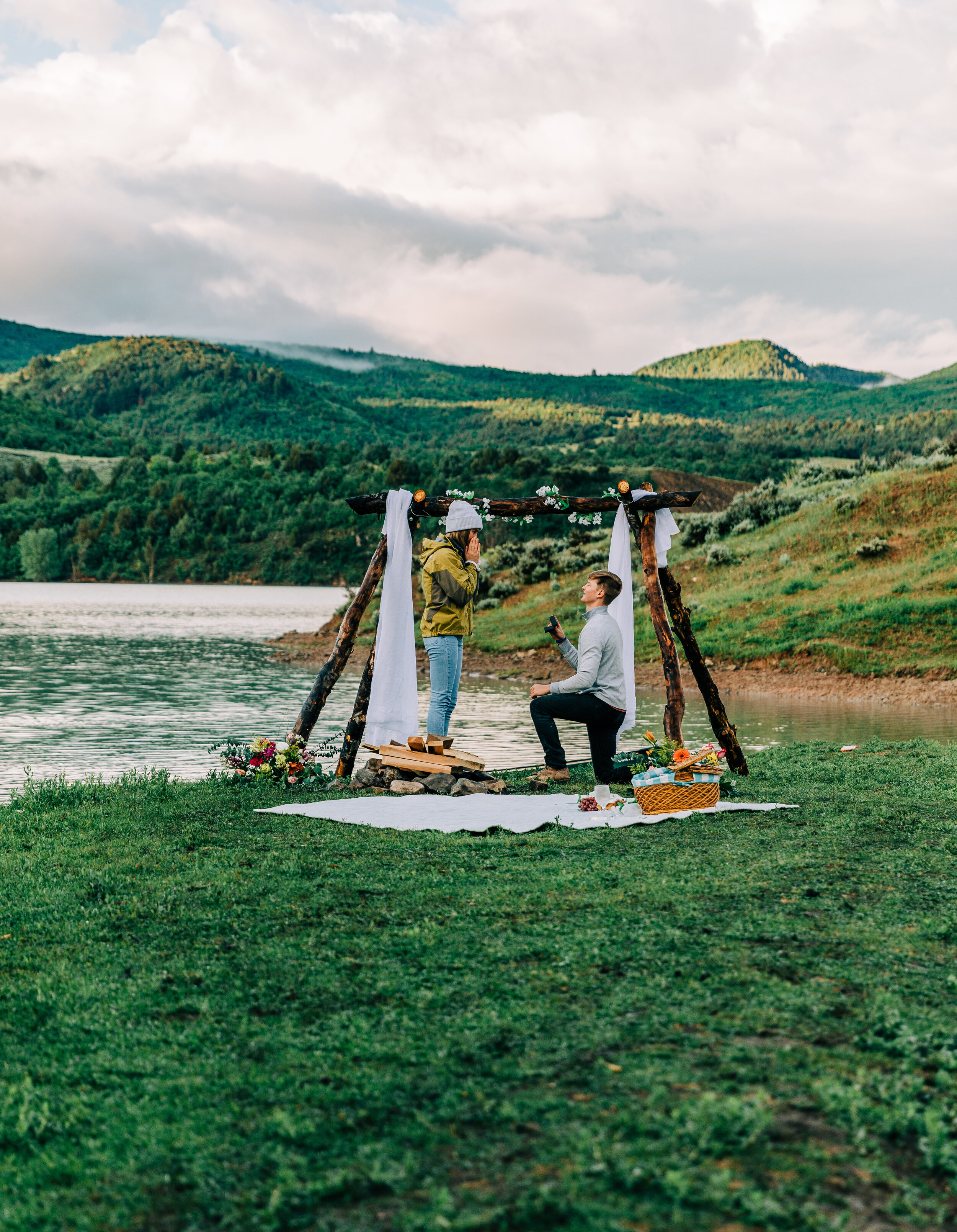  A beautiful surprise sunrise proposal under a romantic boho arch at Porcupine Dam in Paradise, Utah by Bella Alder Photography. Engagement goals couple goals early morning proposal inspiration ideas and goals outdoor proposal decorations engagement 