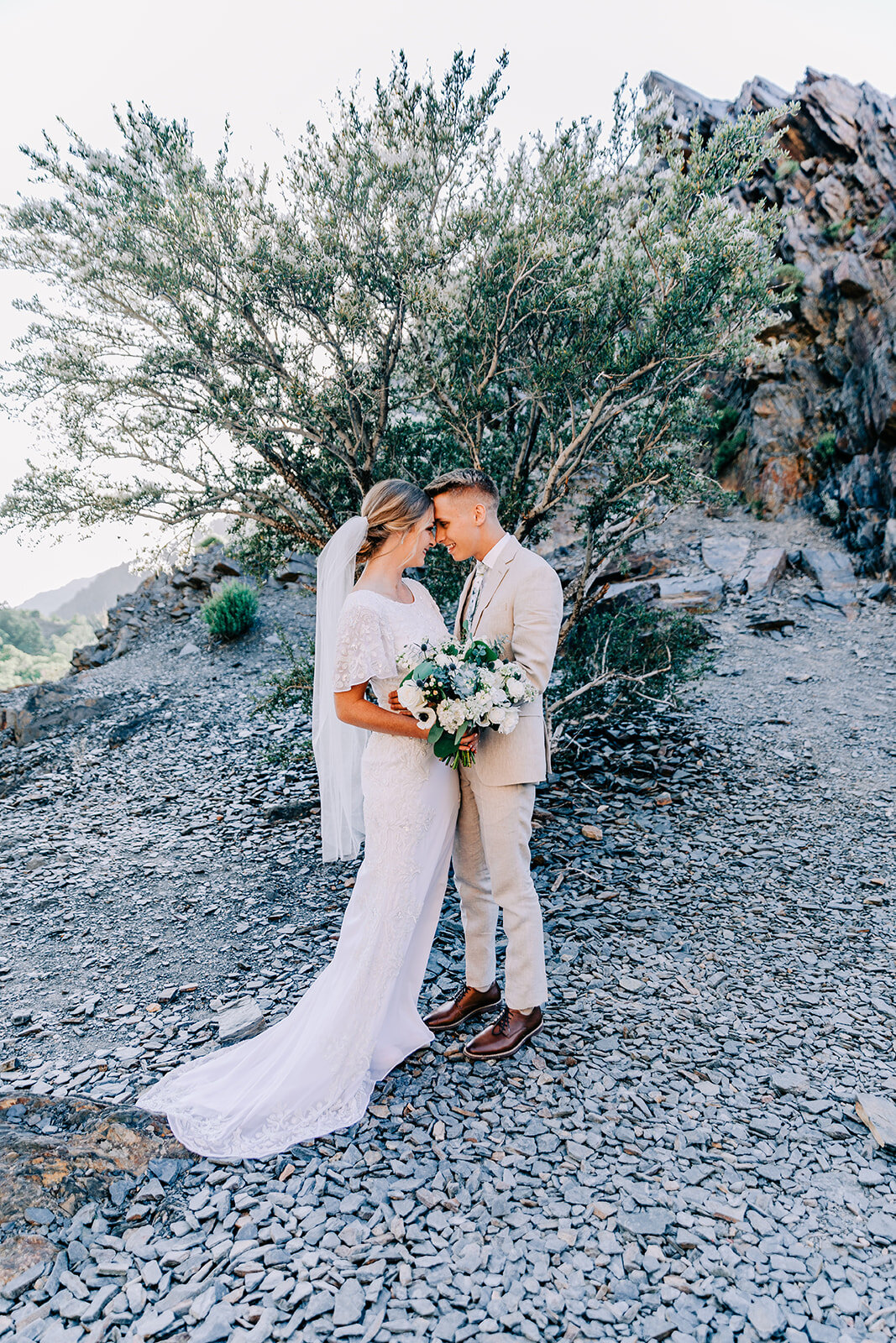  A loving couple staring into each others eyes in a beautiful formal wedding photo shoot by Bella Alder Photography. Cottonwood Canyon wedding photo shoot inspiration summer wedding inspiration professional Utah wedding photographer Bella Alder Photo