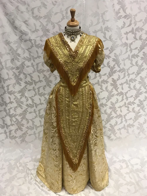 gold dress from hello dolly Iconic Dress: Barbra Streisands gold dress in Hello, Dolly!, 1969. ,  Shimmering golden gown, said to have cost over $10,000 to construct and is  purported to be the most expensive dress ever made