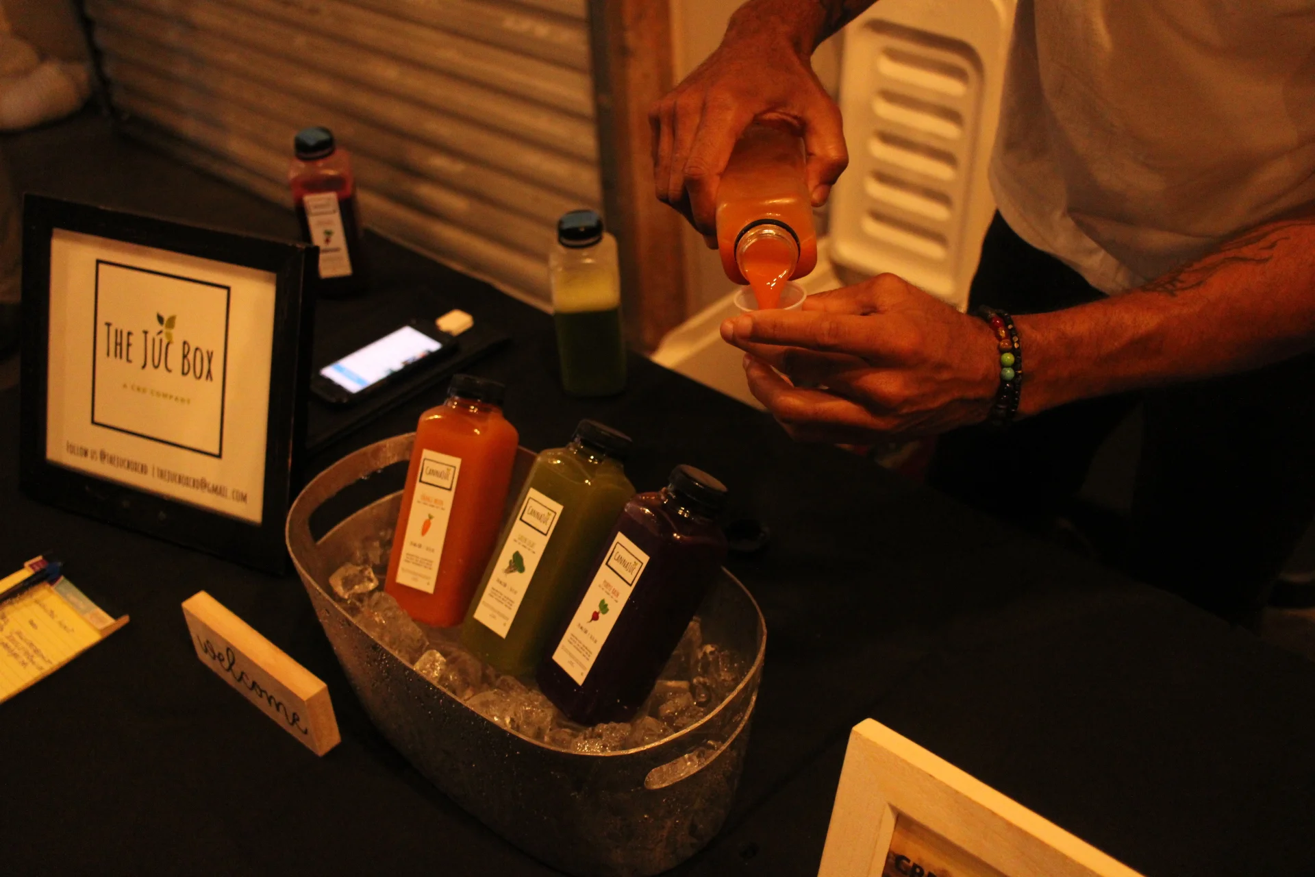 Vendor @thejucbox pouring up samples of their CBD infused pressed juices!