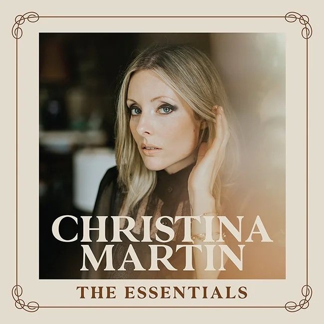 Album cover featuring a close-up portrait of Christina Martin, a blonde woman with soft, natural makeup, looking toward the camera with one hand raised to her hair. Text reads 'Christina Martin', and 'The Essentials'.