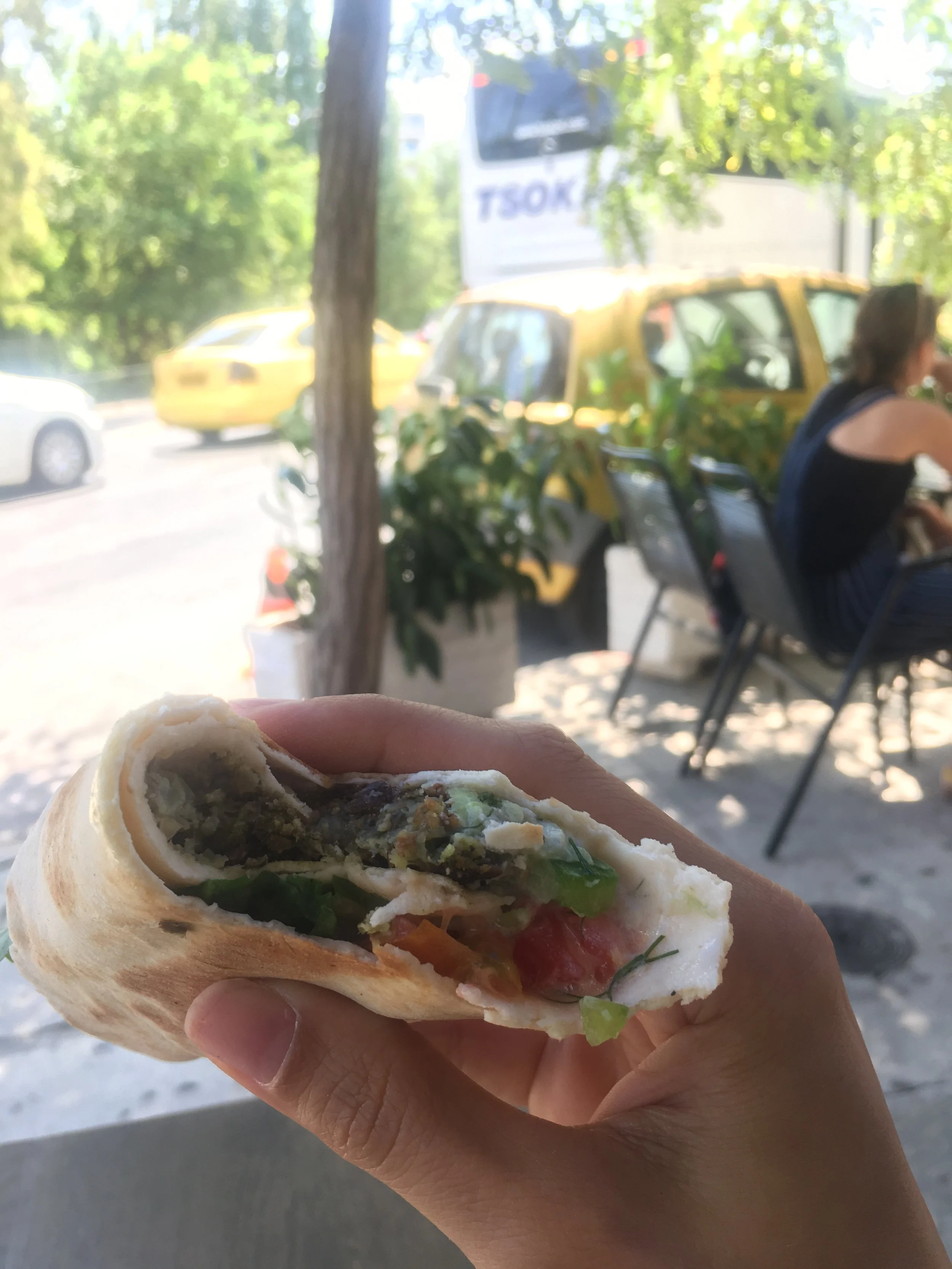 Vegan Rovitsa Wrap and Outdoor Seating at Veganaki in Athens