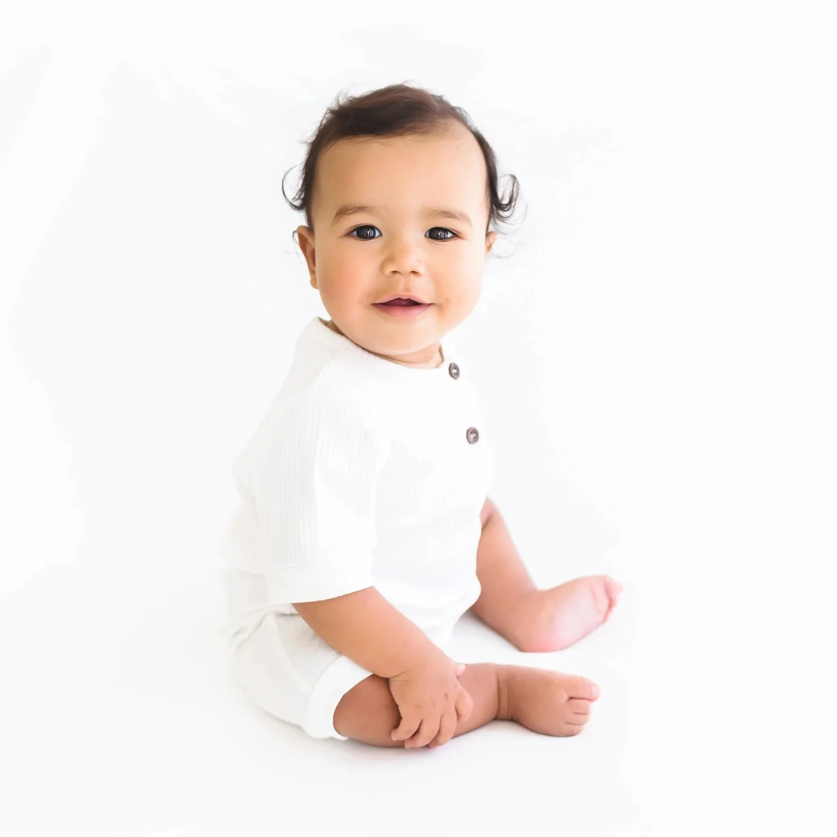 little happy baby  posing for a photo during a baby milestone photoshoot in Lynchburg, VA.jpg