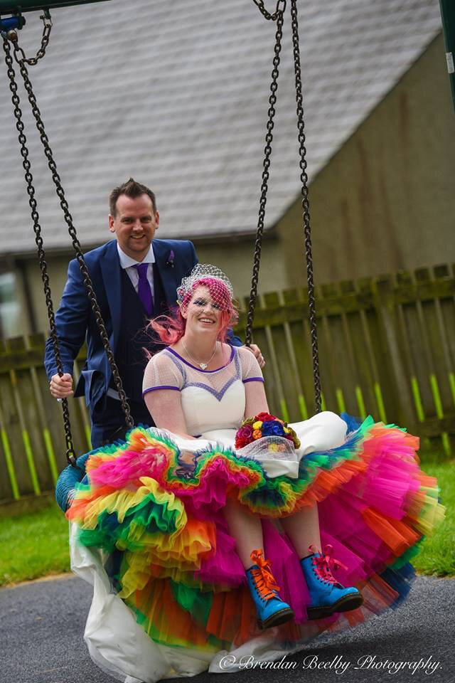 Jo and Gary’s Rainbow Wedding at Chipping Village Hall - amazing rainbow petticoat by Legend Bridal.jpg