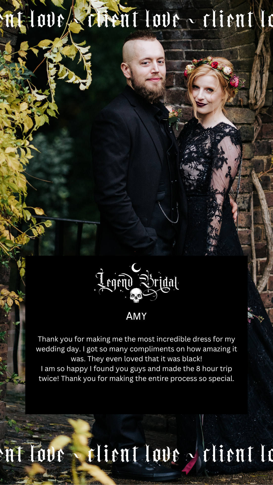A man and woman dressed in gothic wedding attire, standing outdoors against a brick wall with autumn foliage. The man has a shaved head and beard, and the woman has red hair with a floral crown. They are close together, smiling slightly. Testimonial