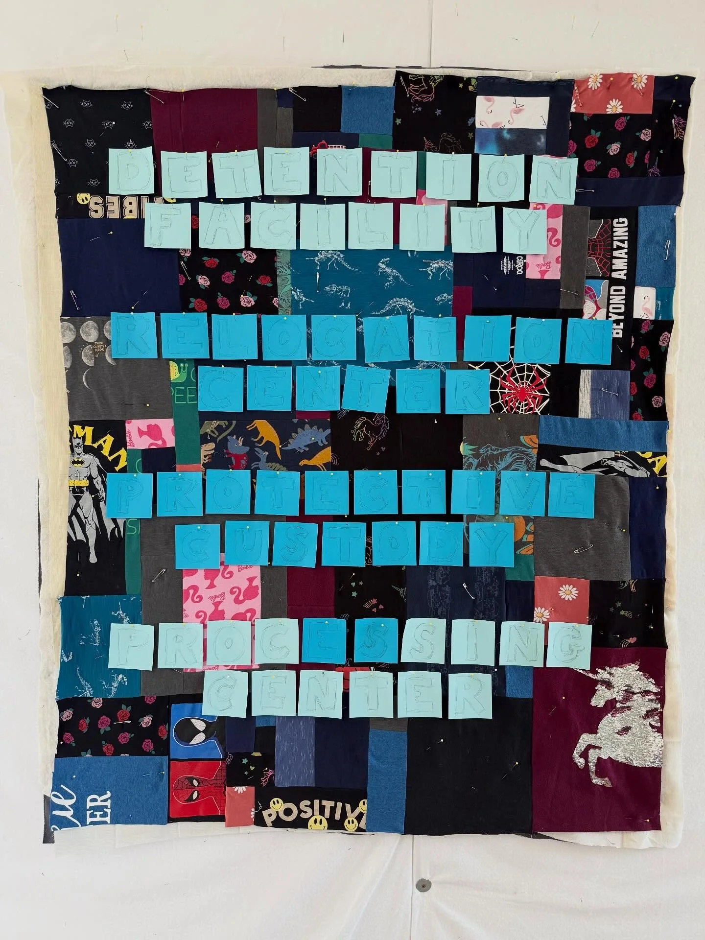 Rage quilting in progress.

My heart is so heavy today. 

I&rsquo;m focusing on just keeping on going.

Layers: 

1) paper templates to get me to the next step
2) t shirt quilt pieced from kids clothes (all thrifted)
3) pieced off-white layer of quil