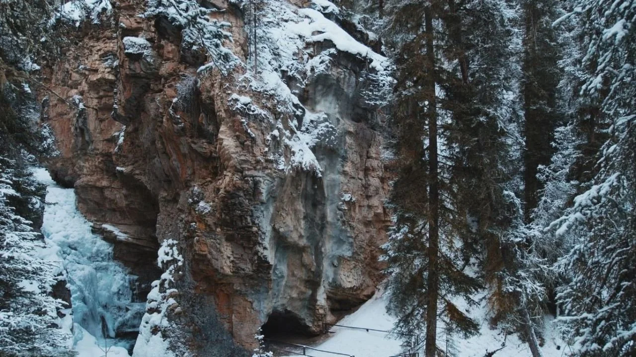 Frozen waterfalls and icy canyon walls along the Johnston Canyon winter hiking trail in Banff.