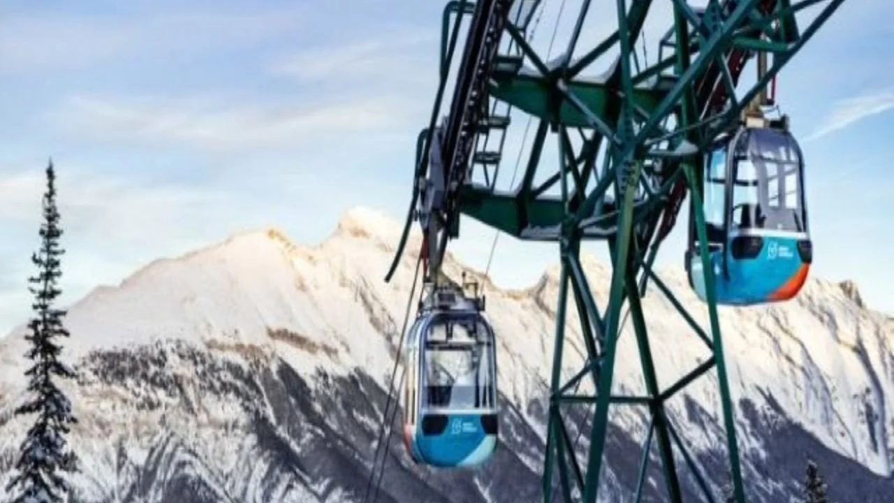 Gondola ride in Banff National Park with panoramic mountain and winter valley views