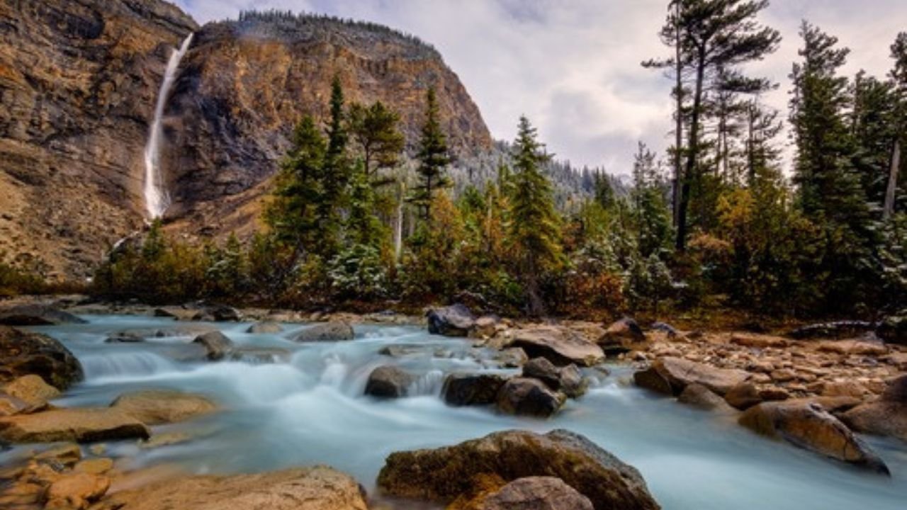 Takakkaw Falls in Yoho National Park with powerful water dropping from high cliffs.