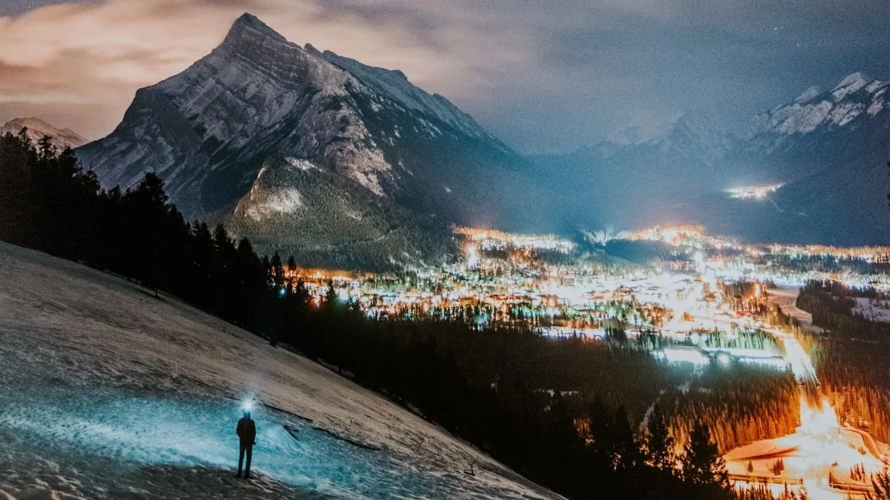 Walk on snowy trails and easy paths during a Canadian Rockies Experience with mountain views