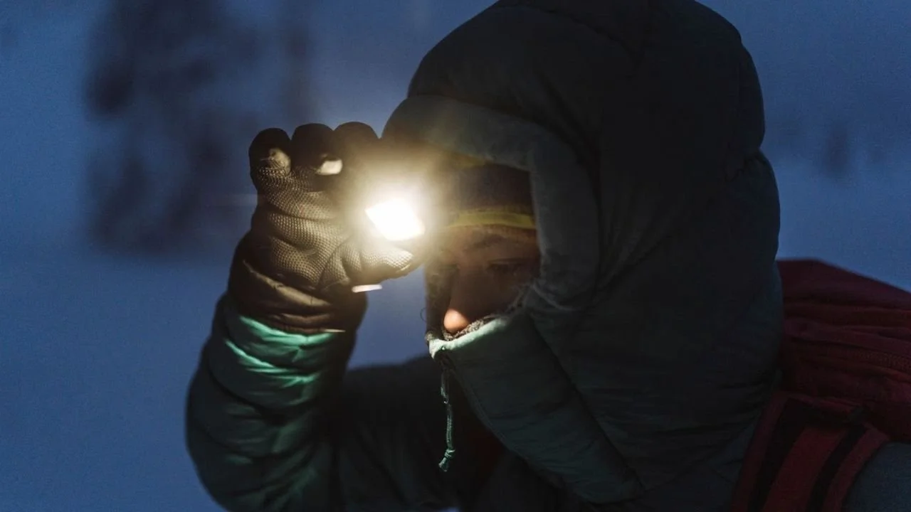 Visitors on a night hiking adventure in the Canadian Rockies.