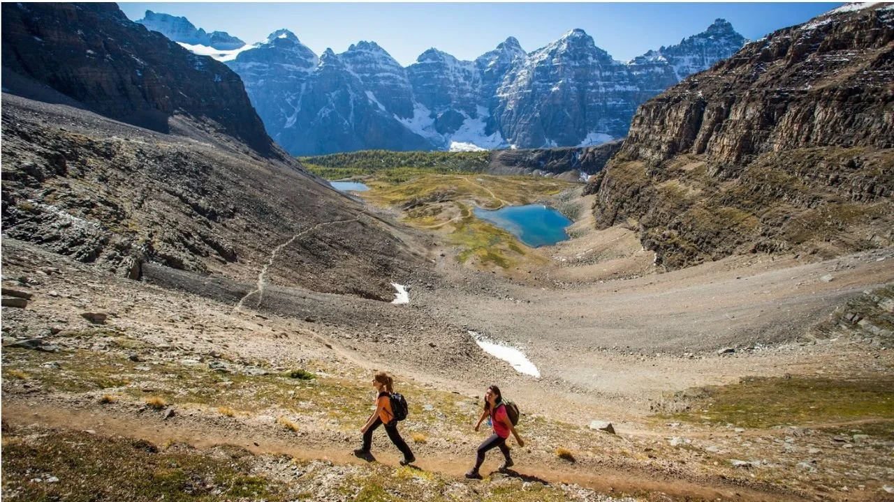 Hikers passing through Sentinel Pass during a Moraine Lake hike. 