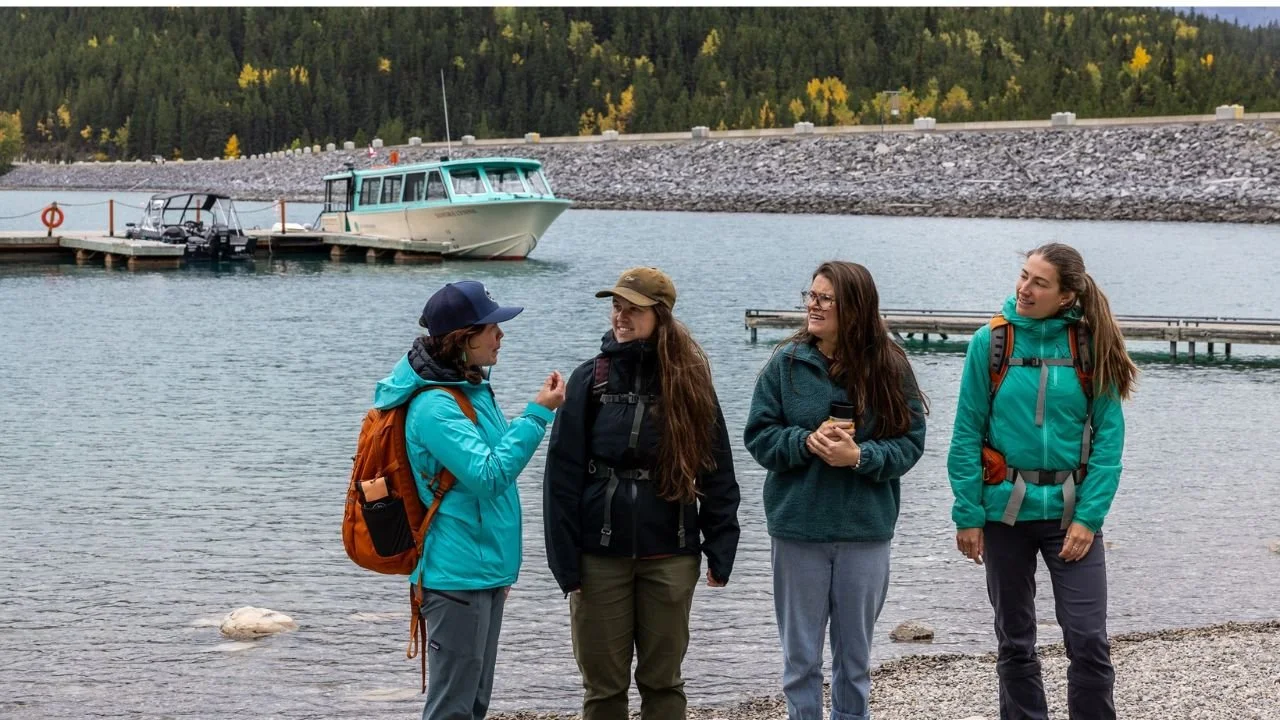 Guided tour group at scenic lake in Johnston Canyon, Banff.