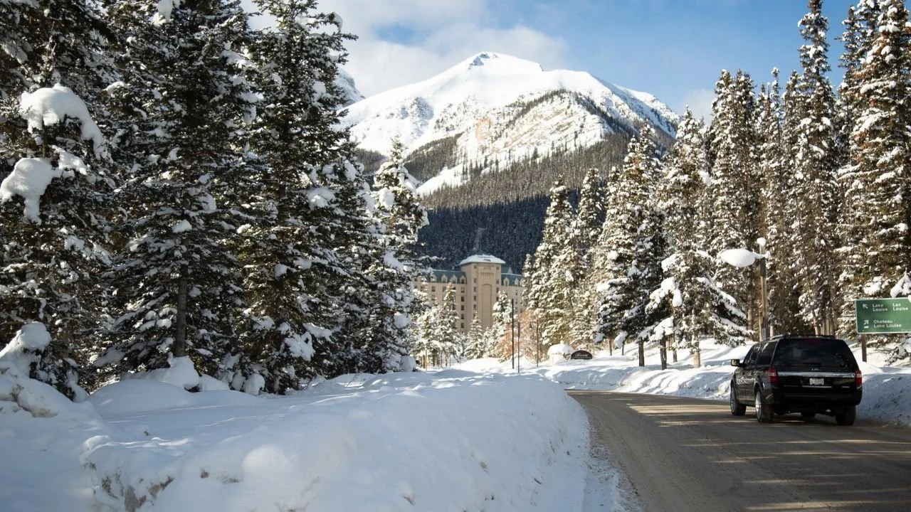 Lake Louise in December with snow-covered streets and winter mountain views